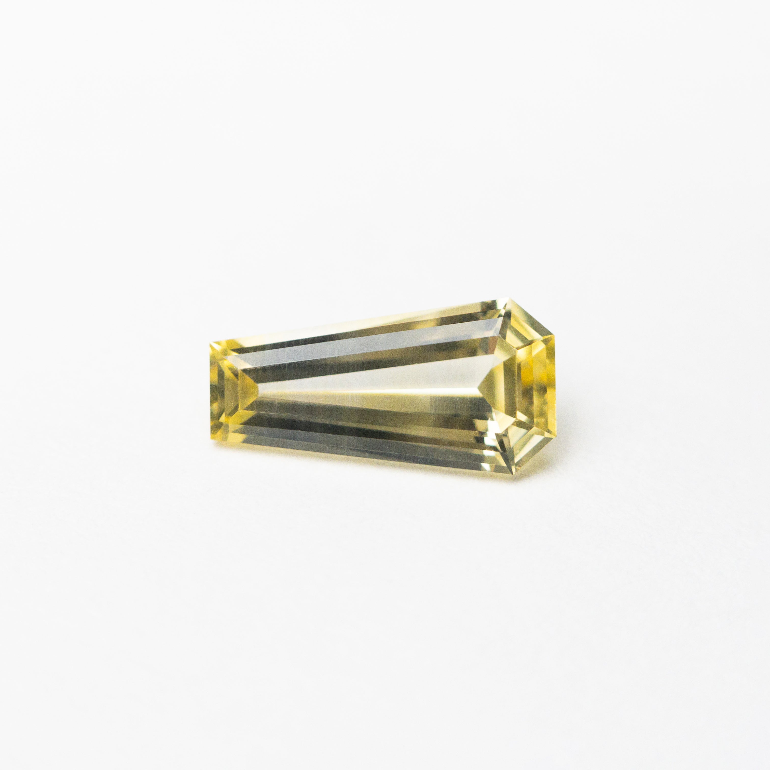 The 0.54ct 7.46x3.81x2.28mm Coffin Step Cut Sapphire 22832-01 by East London jeweller Rachel Boston | Discover our collections of unique and timeless engagement rings, wedding rings, and modern fine jewellery.