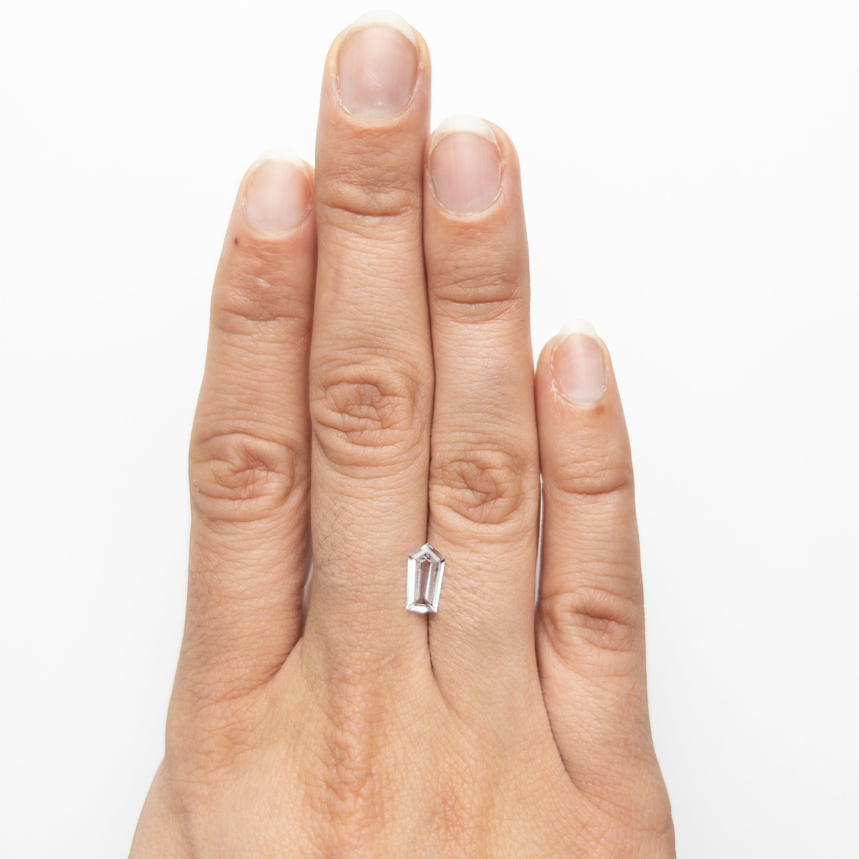 The 0.91ct 8.87x4.84x2.38mm Shield Step Cut Sapphire 22835-01 by East London jeweller Rachel Boston | Discover our collections of unique and timeless engagement rings, wedding rings, and modern fine jewellery.