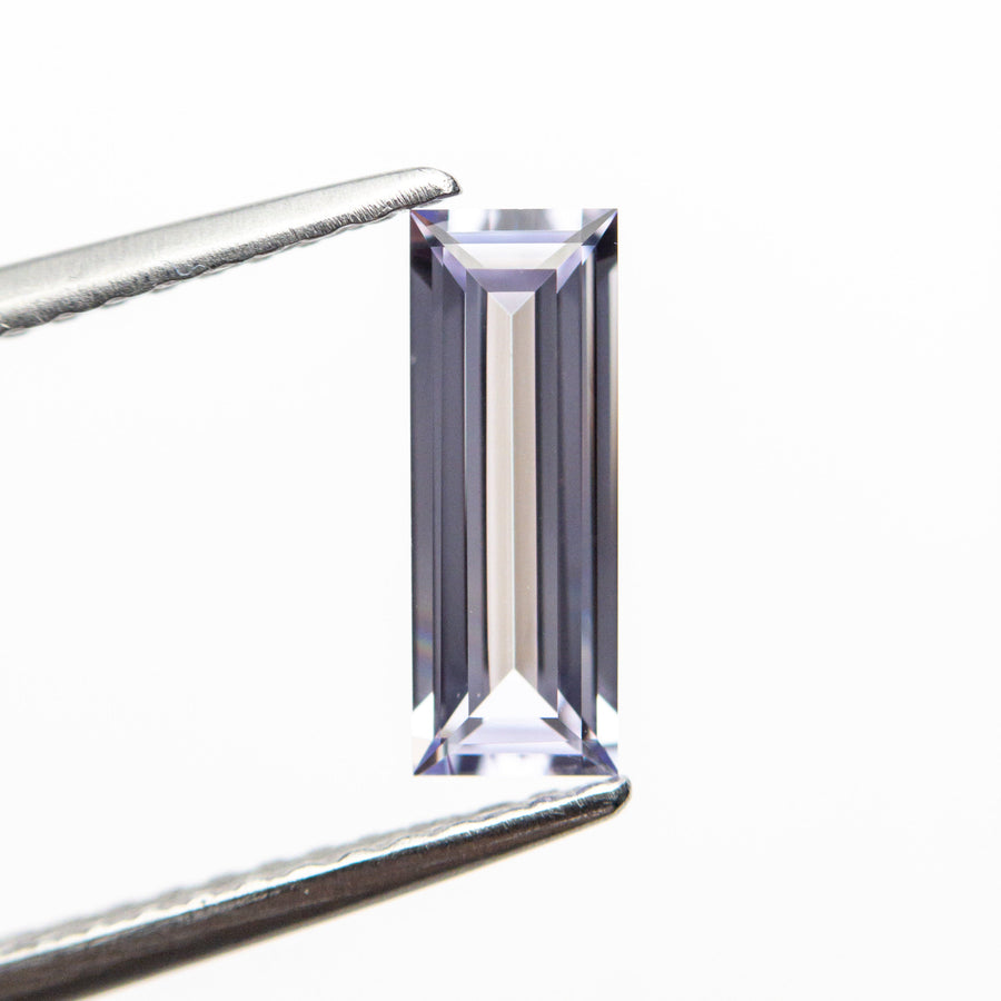 The 0.71ct 9.01x3.28x2.08mm Rectangle Step Cut Sapphire 22877-01 by East London jeweller Rachel Boston | Discover our collections of unique and timeless engagement rings, wedding rings, and modern fine jewellery. - Rachel Boston Jewellery