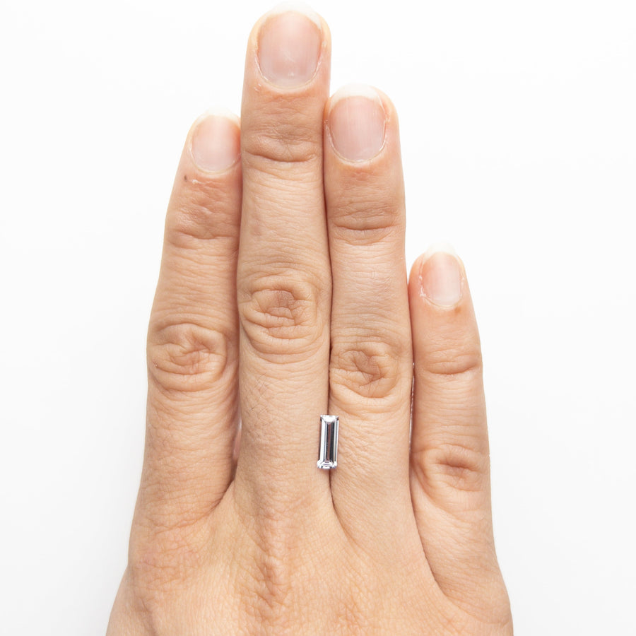 The 0.71ct 9.01x3.28x2.08mm Rectangle Step Cut Sapphire 22877-01 by East London jeweller Rachel Boston | Discover our collections of unique and timeless engagement rings, wedding rings, and modern fine jewellery. - Rachel Boston Jewellery