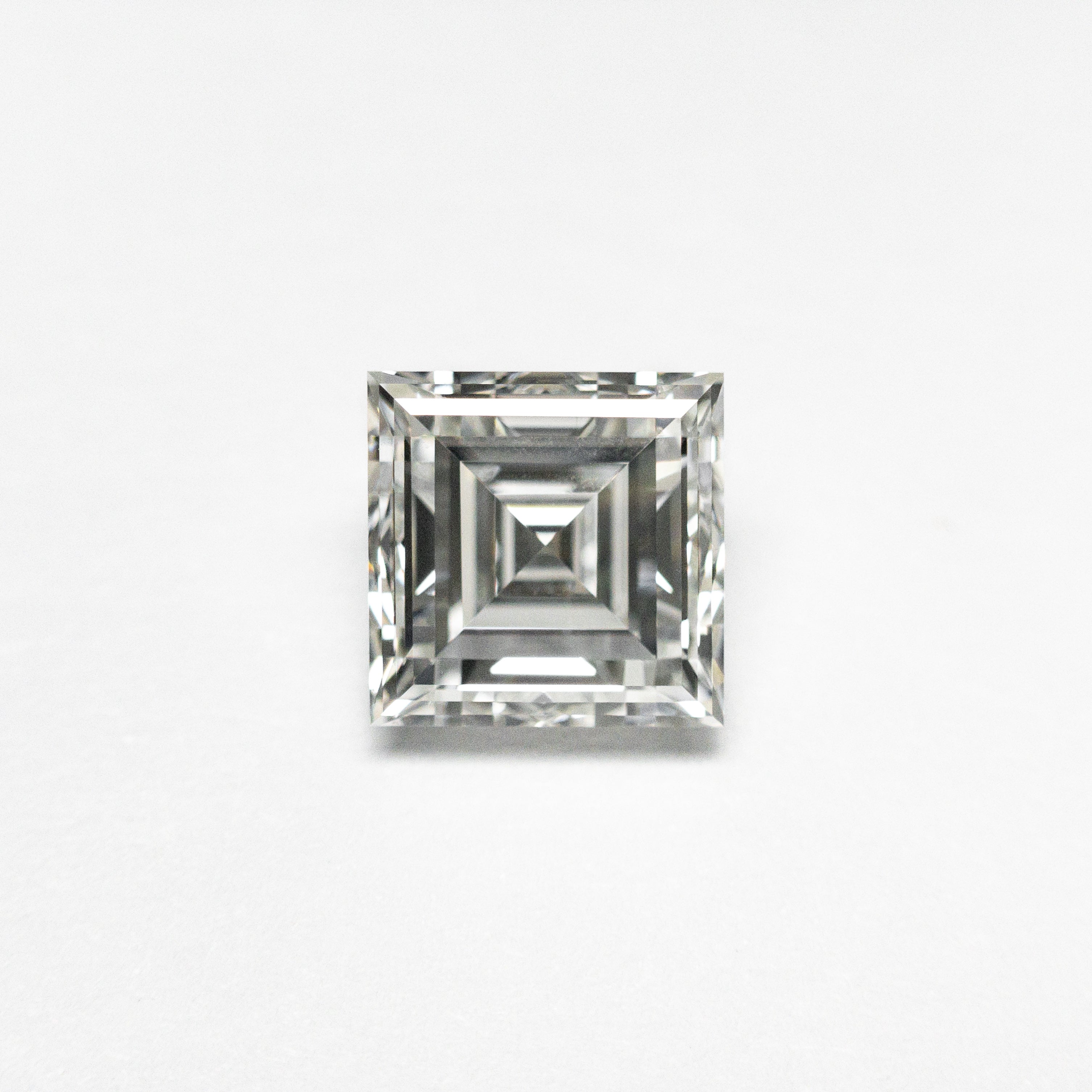 The 0.84ct 5.39x5.39x3.12mm GIA H VS2 Carré Step Cut 23034-01 by East London jeweller Rachel Boston | Discover our collections of unique and timeless engagement rings, wedding rings, and modern fine jewellery.