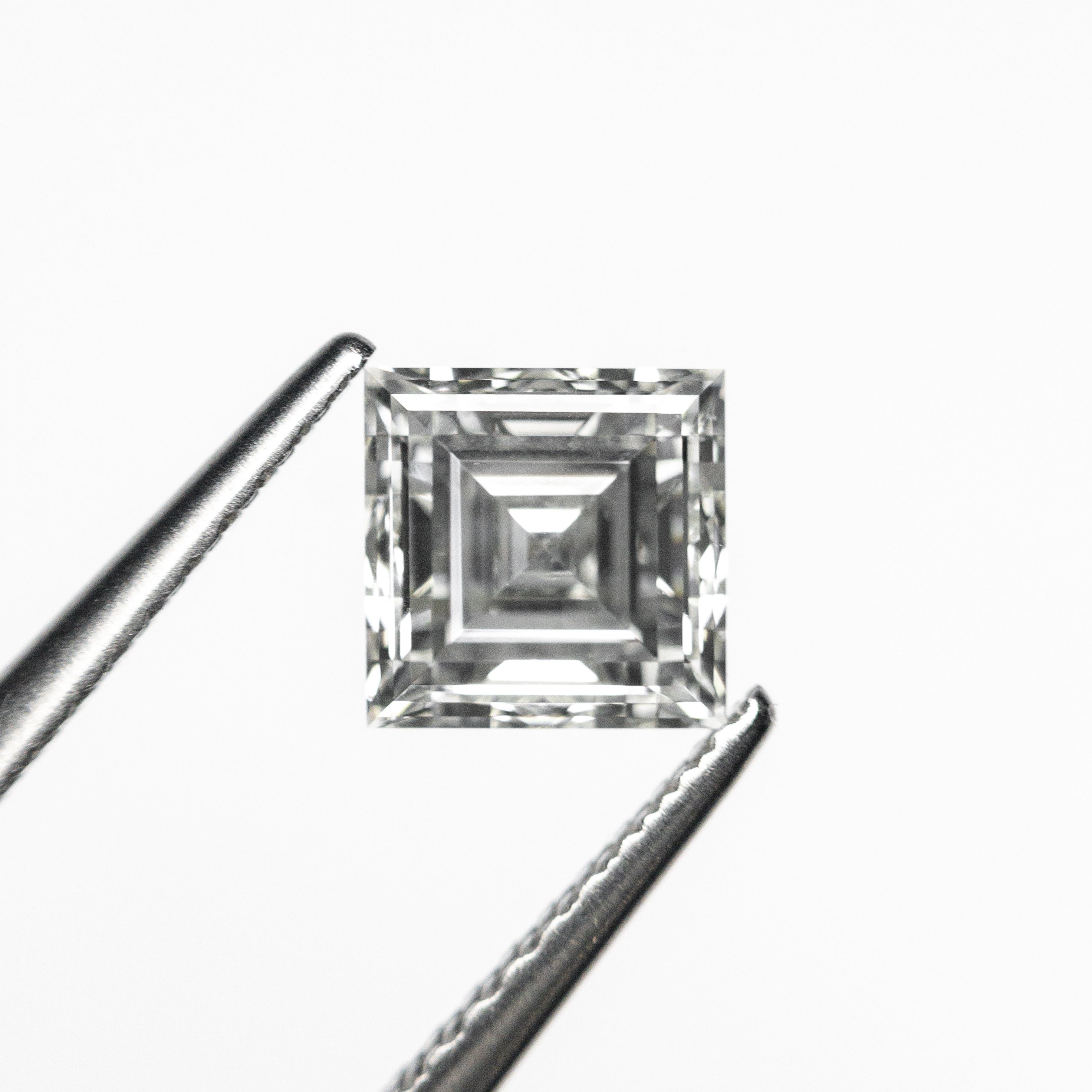 The 0.84ct 5.39x5.39x3.12mm GIA H VS2 Carré Step Cut 23034-01 by East London jeweller Rachel Boston | Discover our collections of unique and timeless engagement rings, wedding rings, and modern fine jewellery.