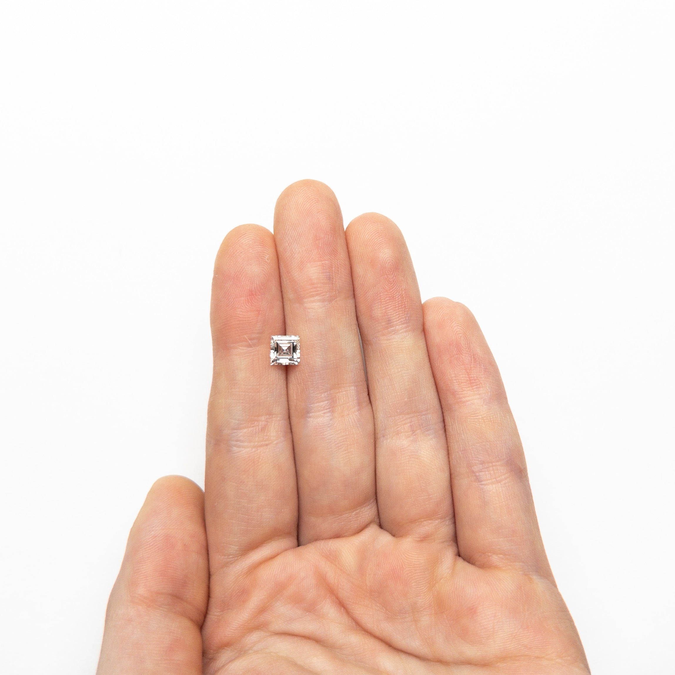 The 0.84ct 5.39x5.39x3.12mm GIA H VS2 Carré Step Cut 23034-01 by East London jeweller Rachel Boston | Discover our collections of unique and timeless engagement rings, wedding rings, and modern fine jewellery.