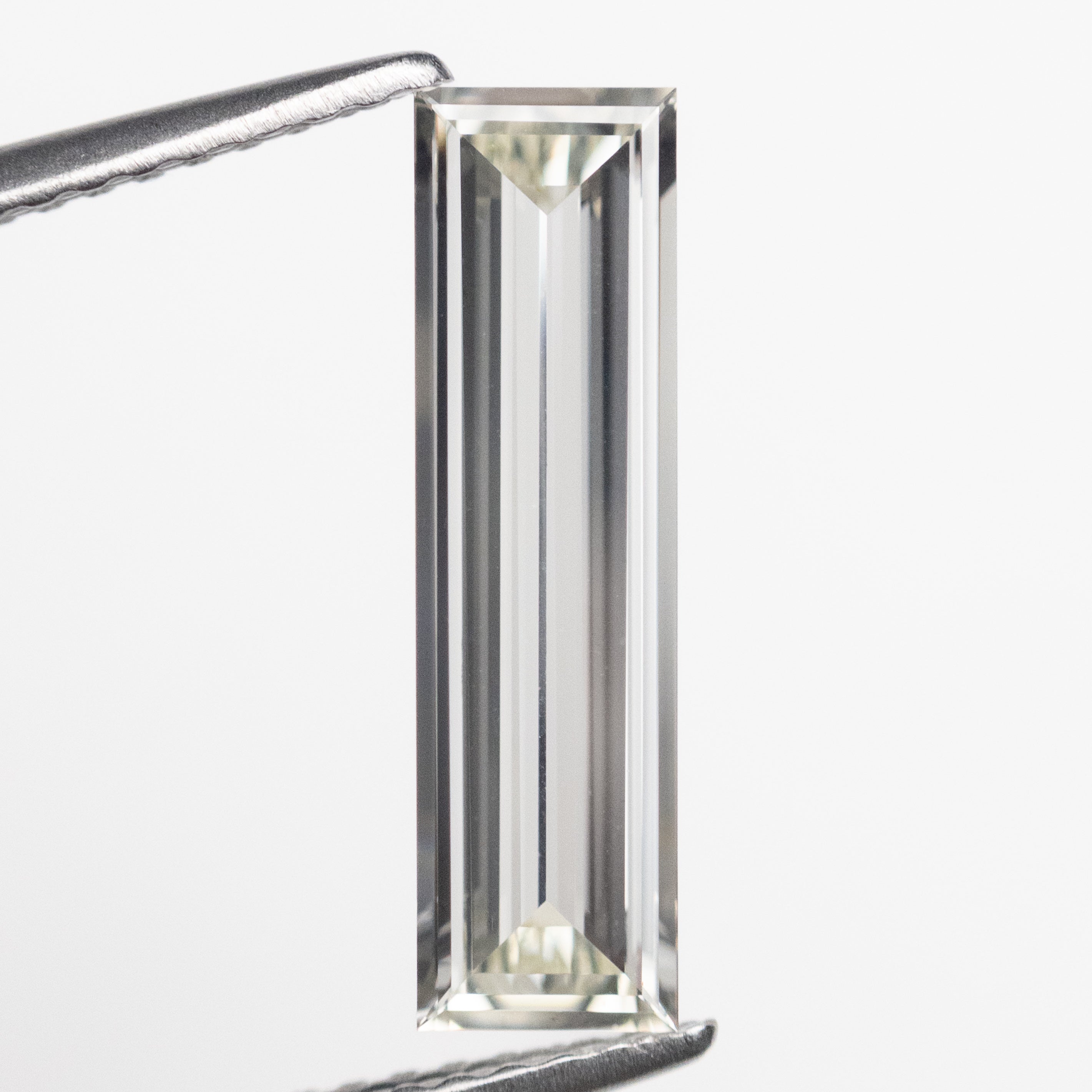 The 1.04ct 15.35x4.17x1.59mm GIA VS2 I Baguette Step Cut 23037-01 by East London jeweller Rachel Boston | Discover our collections of unique and timeless engagement rings, wedding rings, and modern fine jewellery.