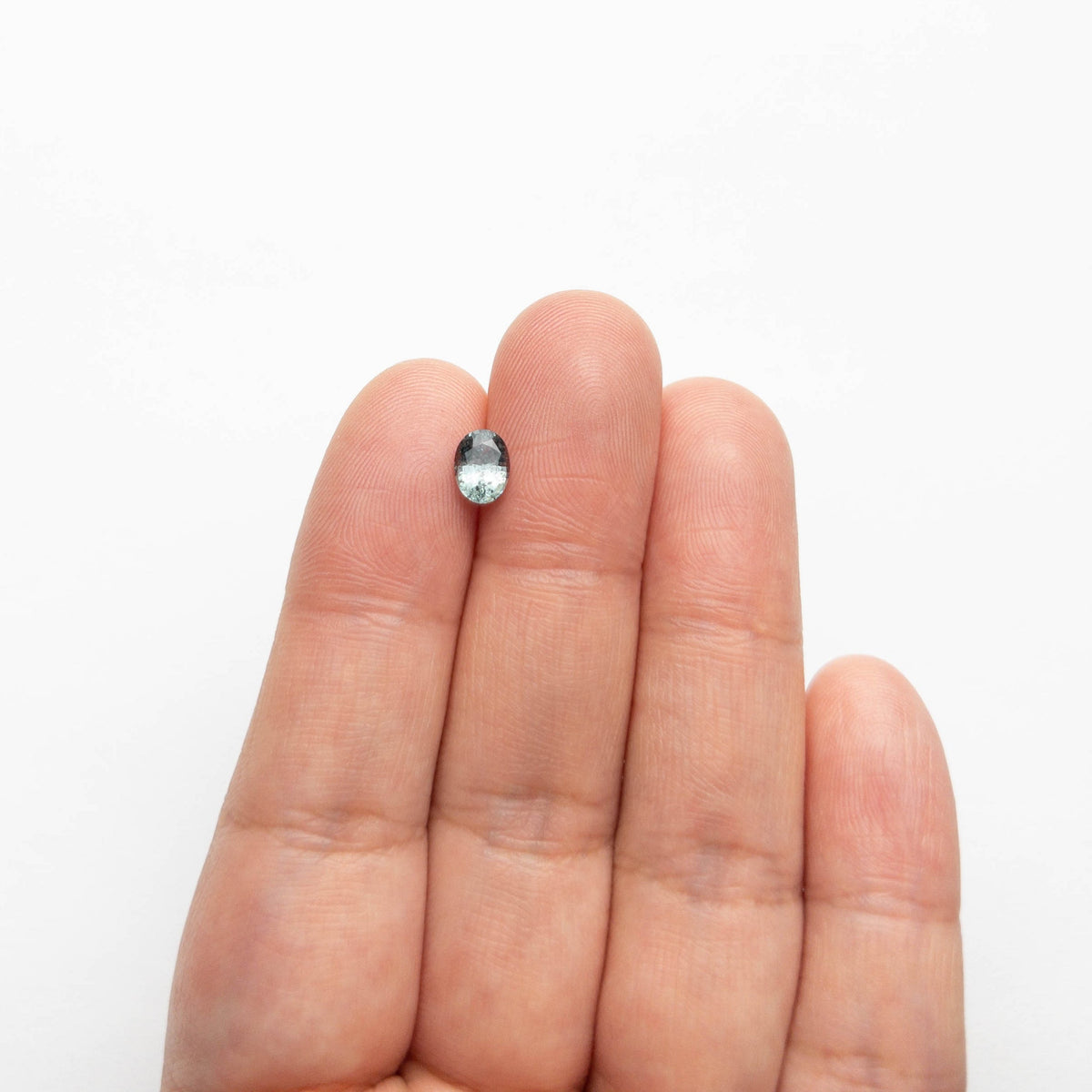 The 0.88ct 6.52x4.87x3.32mm Oval Brilliant Sapphire 23046-01 by East London jeweller Rachel Boston | Discover our collections of unique and timeless engagement rings, wedding rings, and modern fine jewellery.