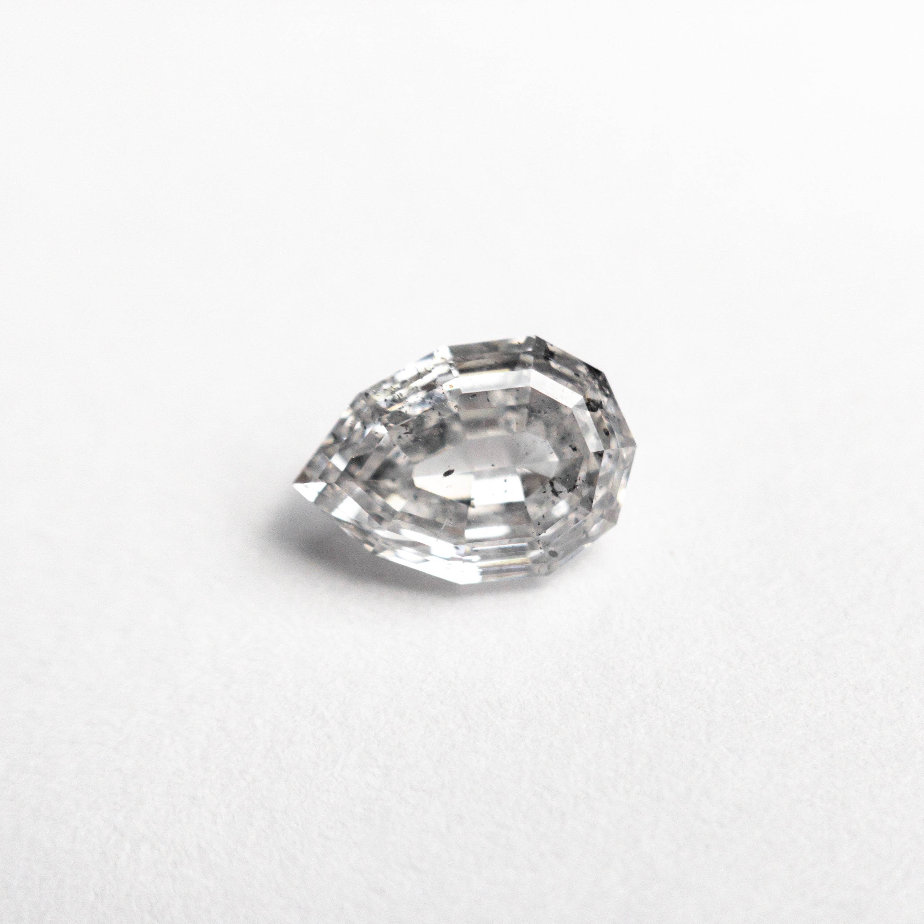 The 0.82ct 7.03x4.86x3.10mm Geo Pear Step Cut 🇨🇦 23255-01 by East London jeweller Rachel Boston | Discover our collections of unique and timeless engagement rings, wedding rings, and modern fine jewellery.