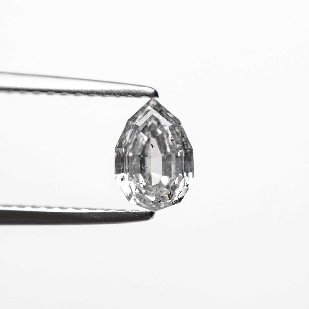 The 0.82ct 7.03x4.86x3.10mm Geo Pear Step Cut 🇨🇦 23255-01 by East London jeweller Rachel Boston | Discover our collections of unique and timeless engagement rings, wedding rings, and modern fine jewellery.
