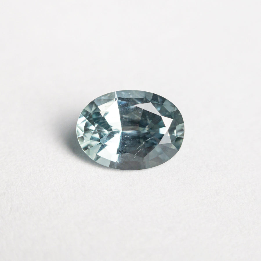 The 0.89ct 6.95x5.13x3.18mm Oval Brilliant Sapphire 23447-29 by East London jeweller Rachel Boston | Discover our collections of unique and timeless engagement rings, wedding rings, and modern fine jewellery. - Rachel Boston Jewellery