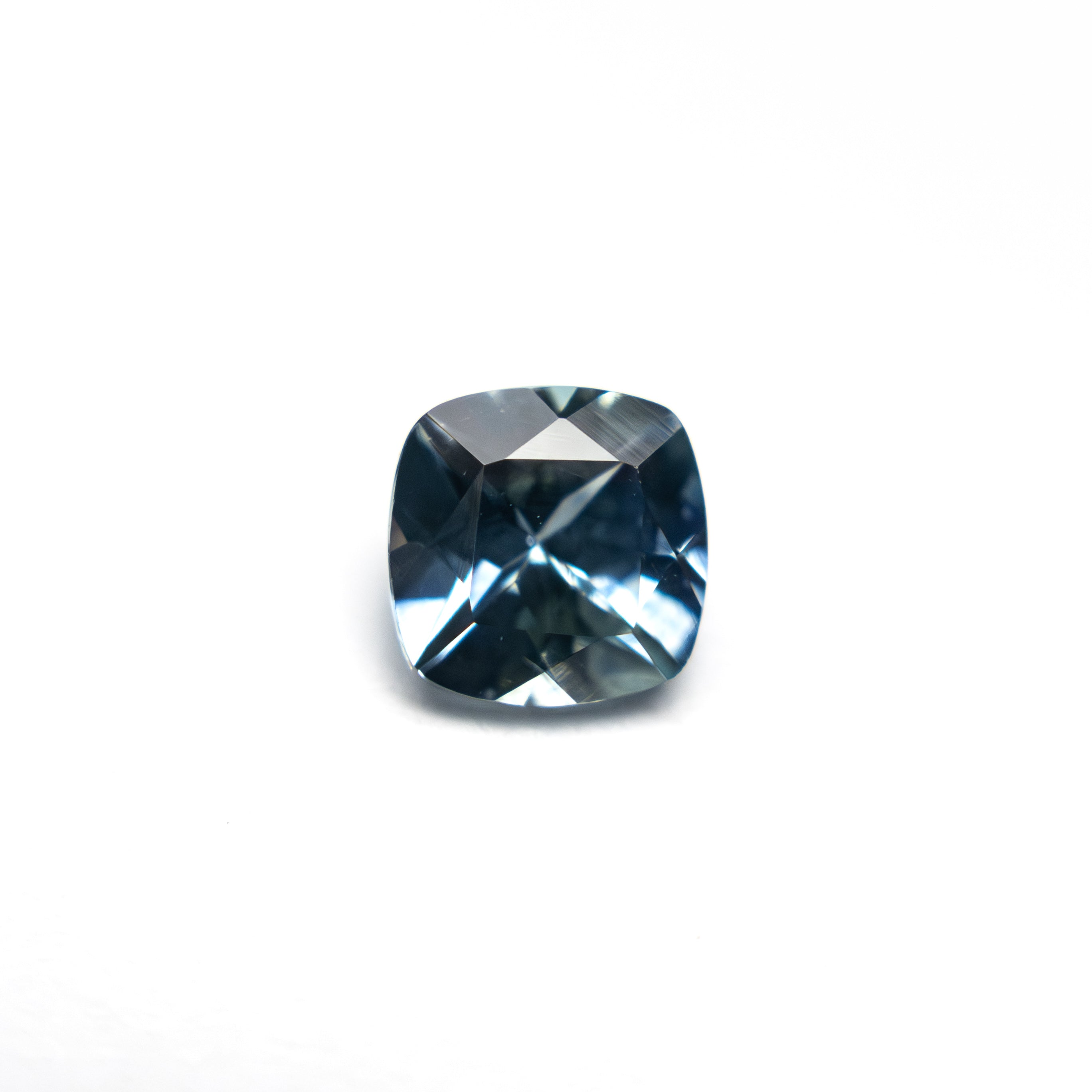 The 0.72ct 4.99x4.98x3.31mm Cushion Brilliant Sapphire 23466-03 by East London jeweller Rachel Boston | Discover our collections of unique and timeless engagement rings, wedding rings, and modern fine jewellery.