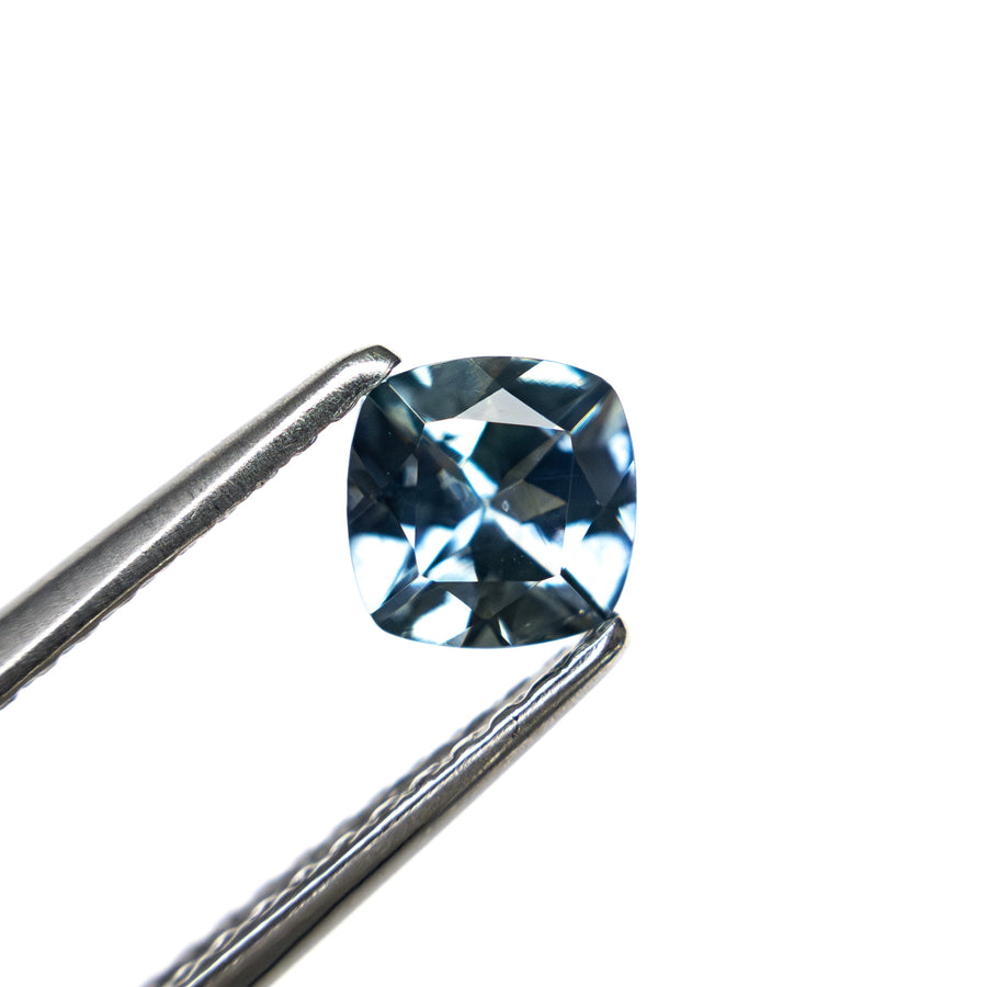 The 0.72ct 4.99x4.98x3.31mm Cushion Brilliant Sapphire 23466-03 by East London jeweller Rachel Boston | Discover our collections of unique and timeless engagement rings, wedding rings, and modern fine jewellery. - Rachel Boston Jewellery