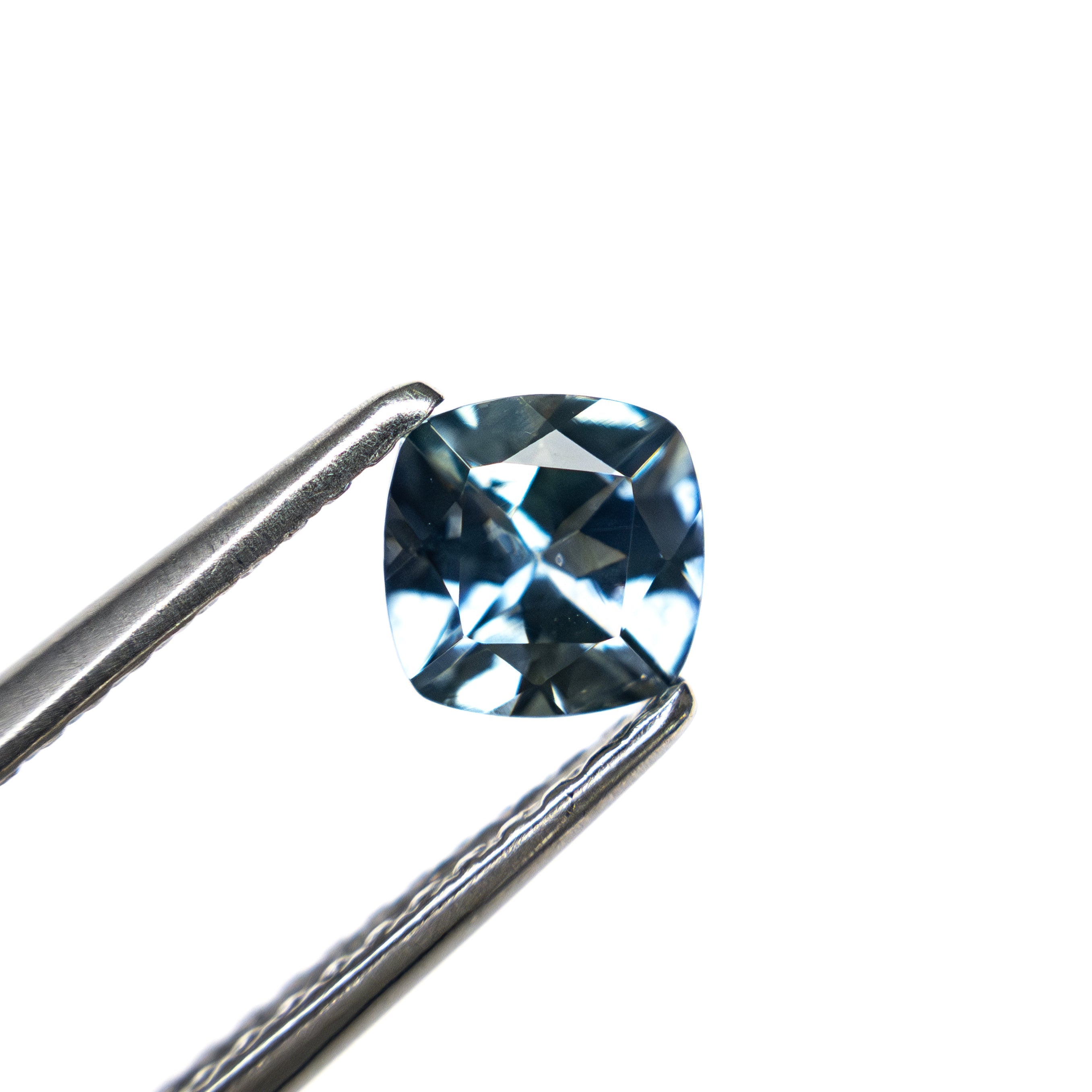 The 0.72ct 4.99x4.98x3.31mm Cushion Brilliant Sapphire 23466-03 by East London jeweller Rachel Boston | Discover our collections of unique and timeless engagement rings, wedding rings, and modern fine jewellery.
