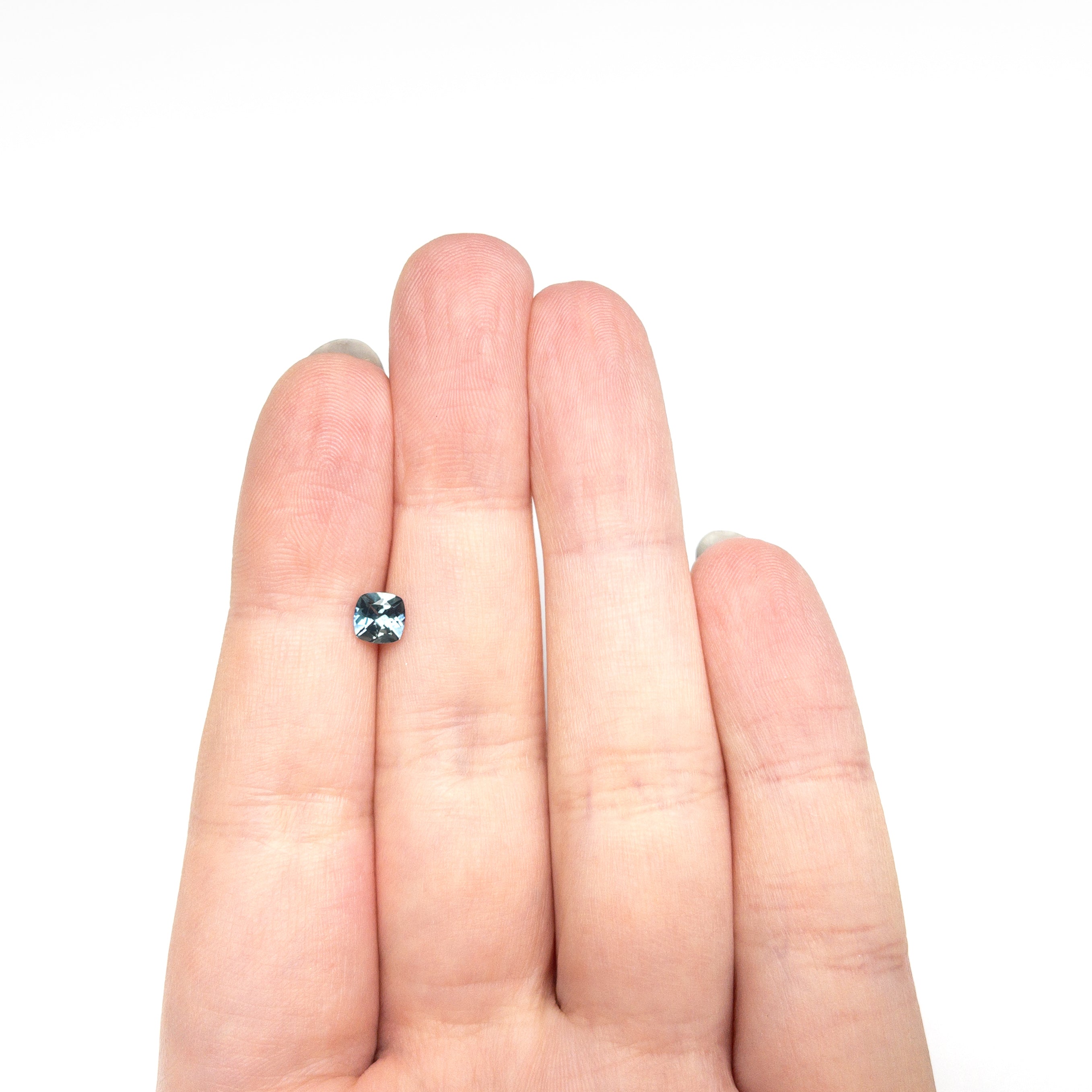 The 0.72ct 4.99x4.98x3.31mm Cushion Brilliant Sapphire 23466-03 by East London jeweller Rachel Boston | Discover our collections of unique and timeless engagement rings, wedding rings, and modern fine jewellery.