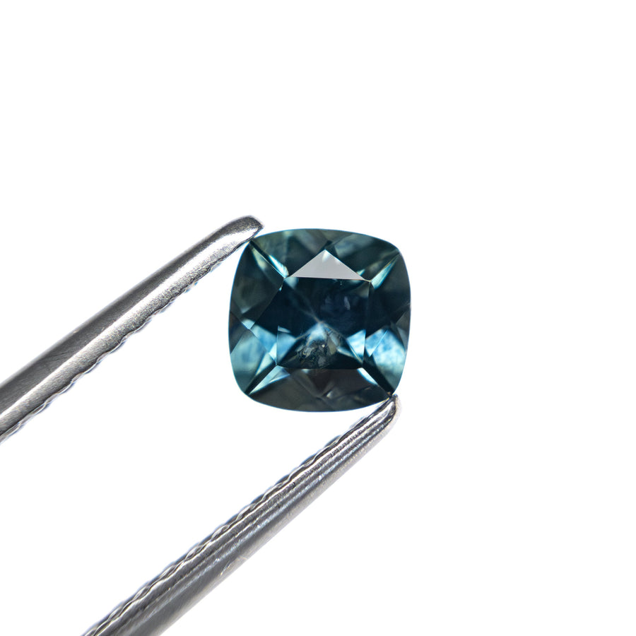 The 0.69ct 5.05x5.01x3.38mm Cushion Brilliant Sapphire 23466-05 by East London jeweller Rachel Boston | Discover our collections of unique and timeless engagement rings, wedding rings, and modern fine jewellery. - Rachel Boston Jewellery
