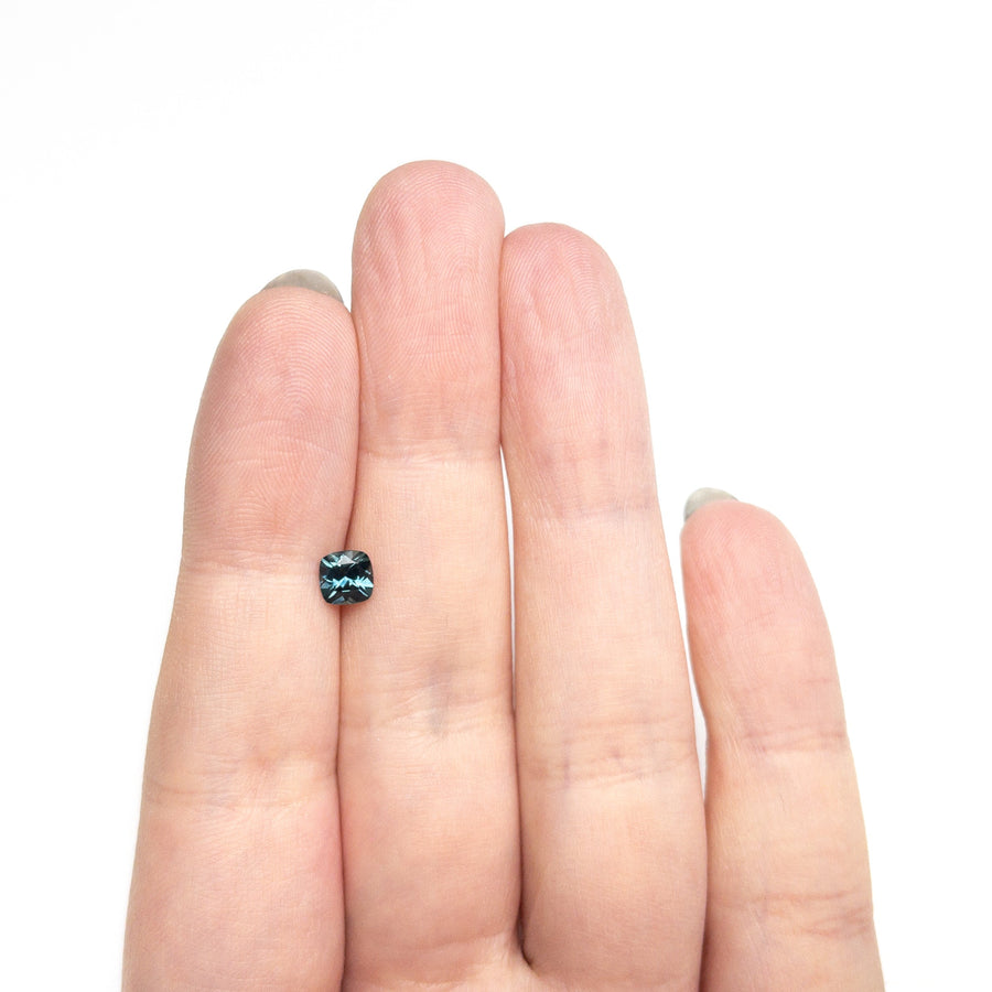 The 0.69ct 5.05x5.01x3.38mm Cushion Brilliant Sapphire 23466-05 by East London jeweller Rachel Boston | Discover our collections of unique and timeless engagement rings, wedding rings, and modern fine jewellery. - Rachel Boston Jewellery