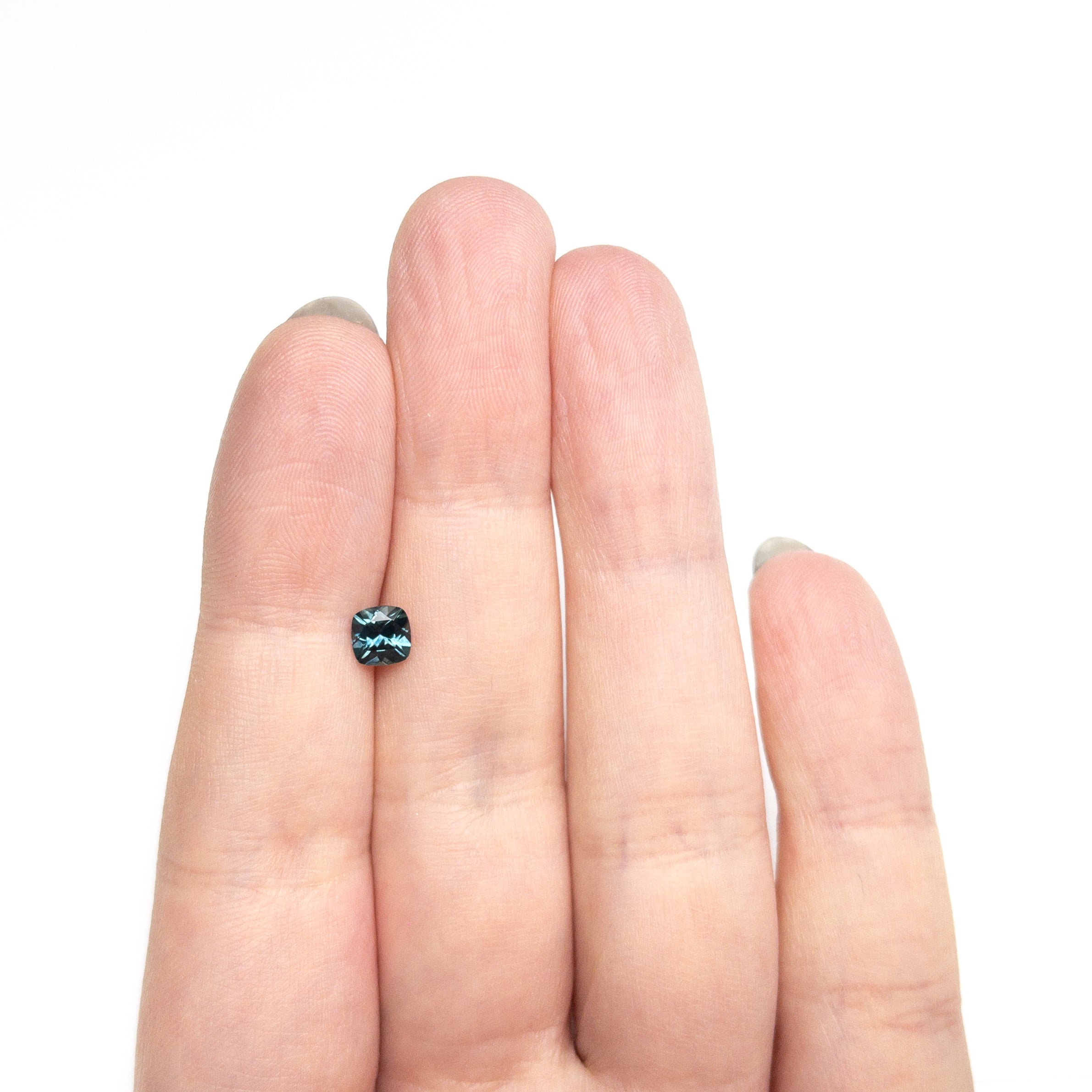 The 0.69ct 5.05x5.01x3.38mm Cushion Brilliant Sapphire 23466-05 by East London jeweller Rachel Boston | Discover our collections of unique and timeless engagement rings, wedding rings, and modern fine jewellery.