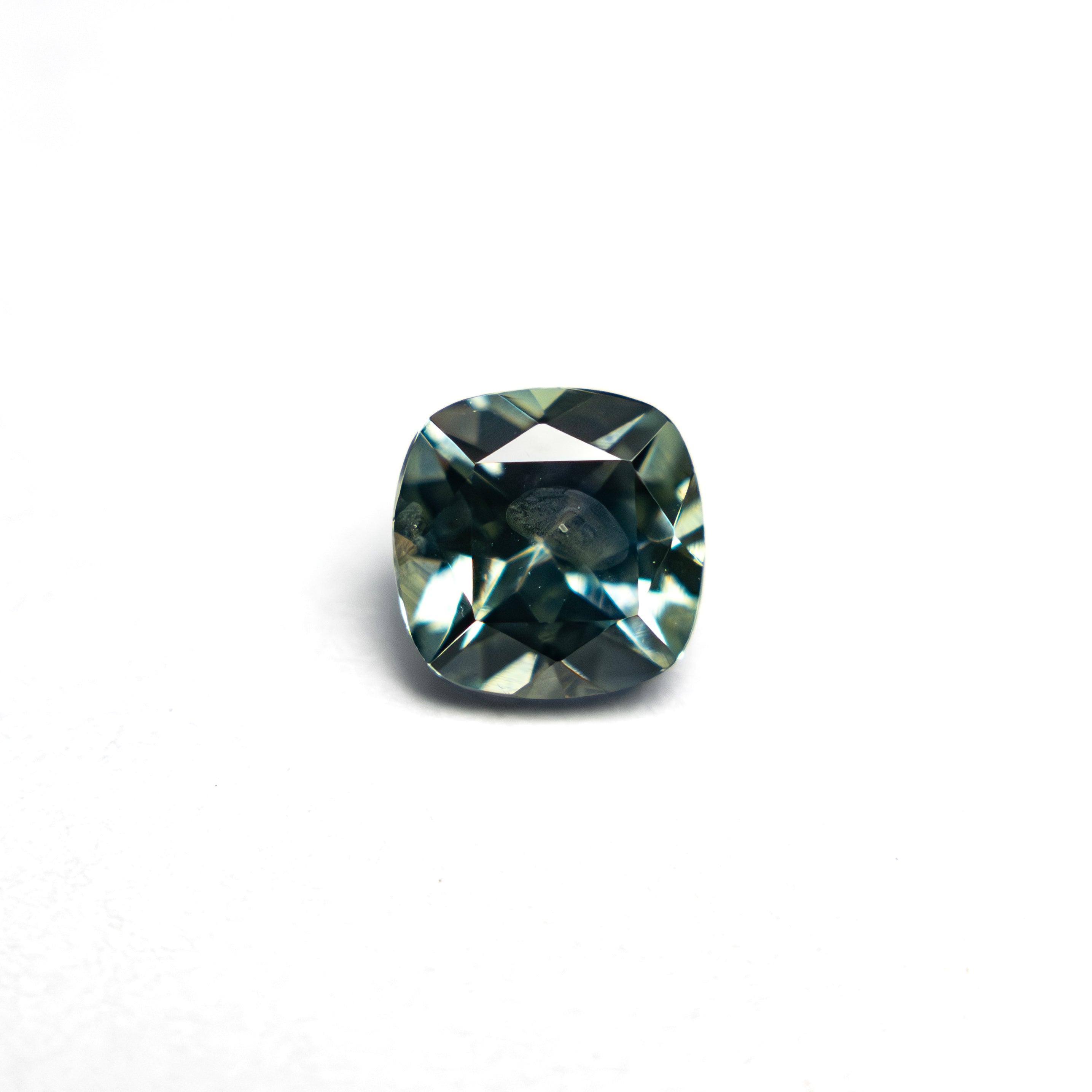 The 0.78ct 5.11x5.09x3.40mm Cushion Brilliant Sapphire 23466-08 by East London jeweller Rachel Boston | Discover our collections of unique and timeless engagement rings, wedding rings, and modern fine jewellery.