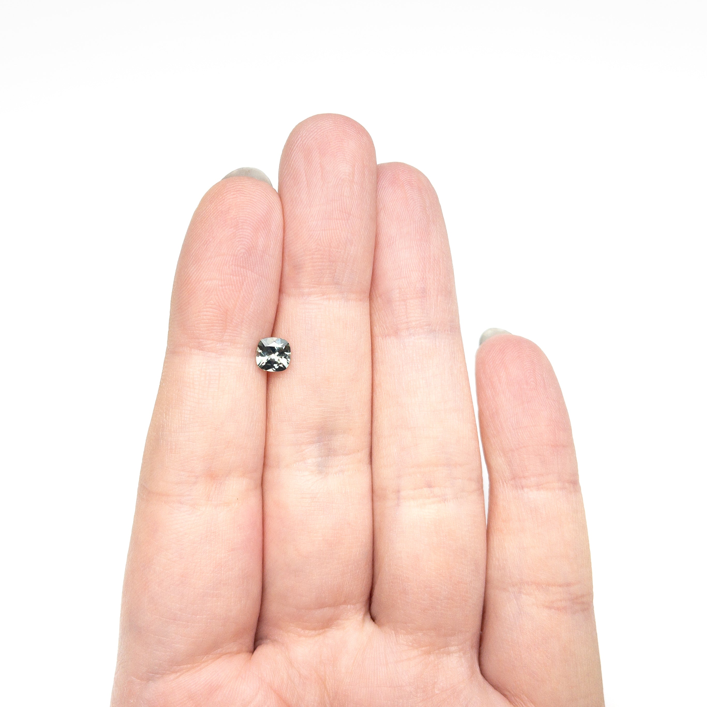 The 0.78ct 5.11x5.09x3.40mm Cushion Brilliant Sapphire 23466-08 by East London jeweller Rachel Boston | Discover our collections of unique and timeless engagement rings, wedding rings, and modern fine jewellery.
