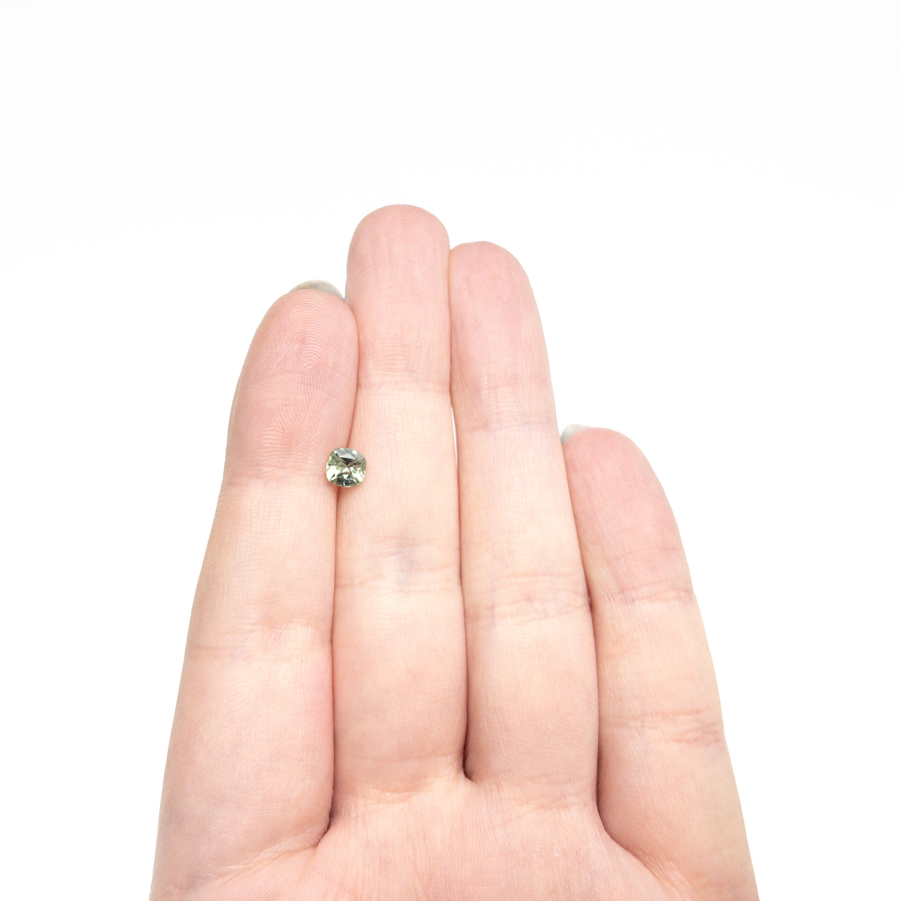 The 0.70ct 5.02x4.98x3.14mm CUshion Brilliant Sapphire 23466-09 by East London jeweller Rachel Boston | Discover our collections of unique and timeless engagement rings, wedding rings, and modern fine jewellery.