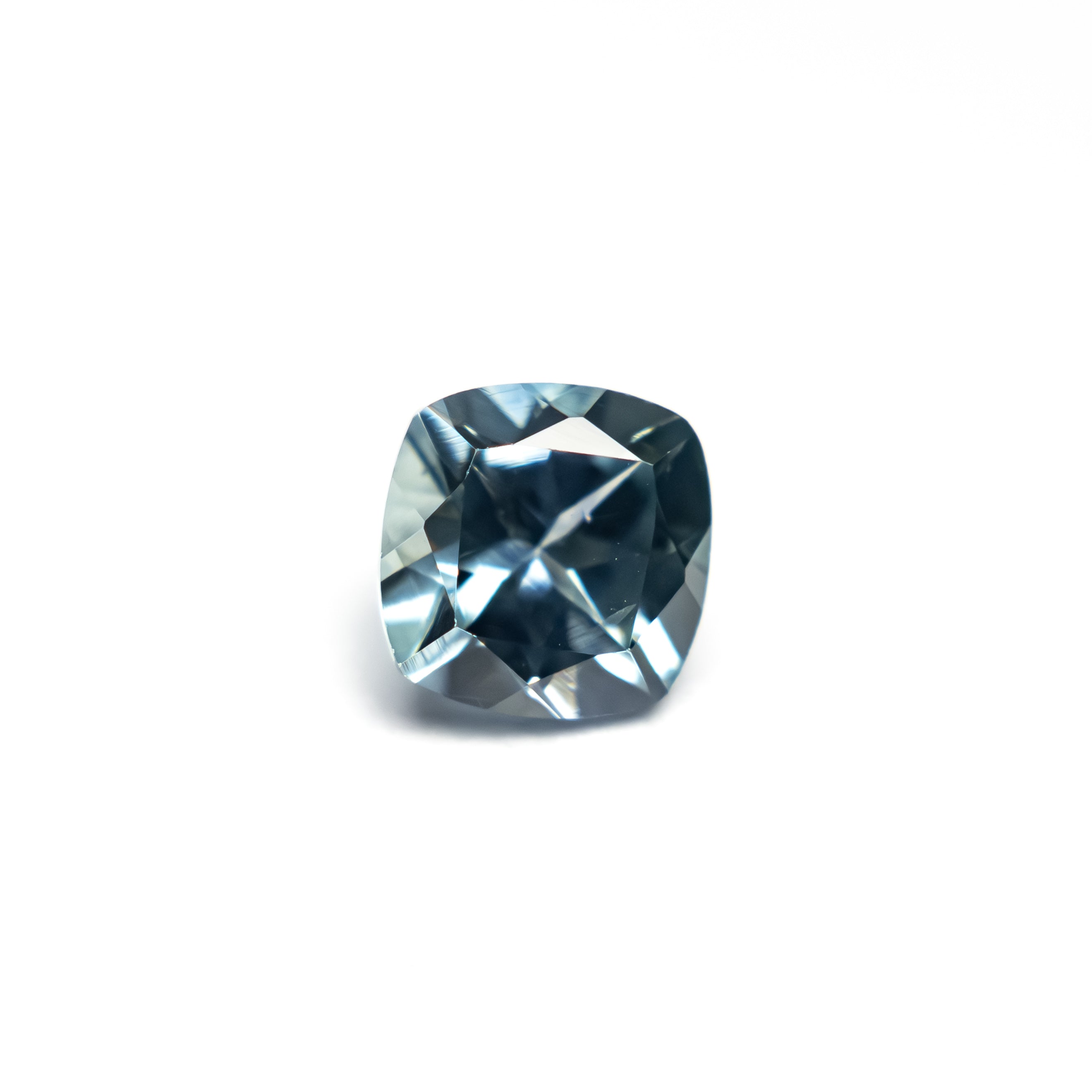 The 0.76ct 5.06x5.00x3.48mm Cushion Brilliant Sapphire 23466-13 by East London jeweller Rachel Boston | Discover our collections of unique and timeless engagement rings, wedding rings, and modern fine jewellery.