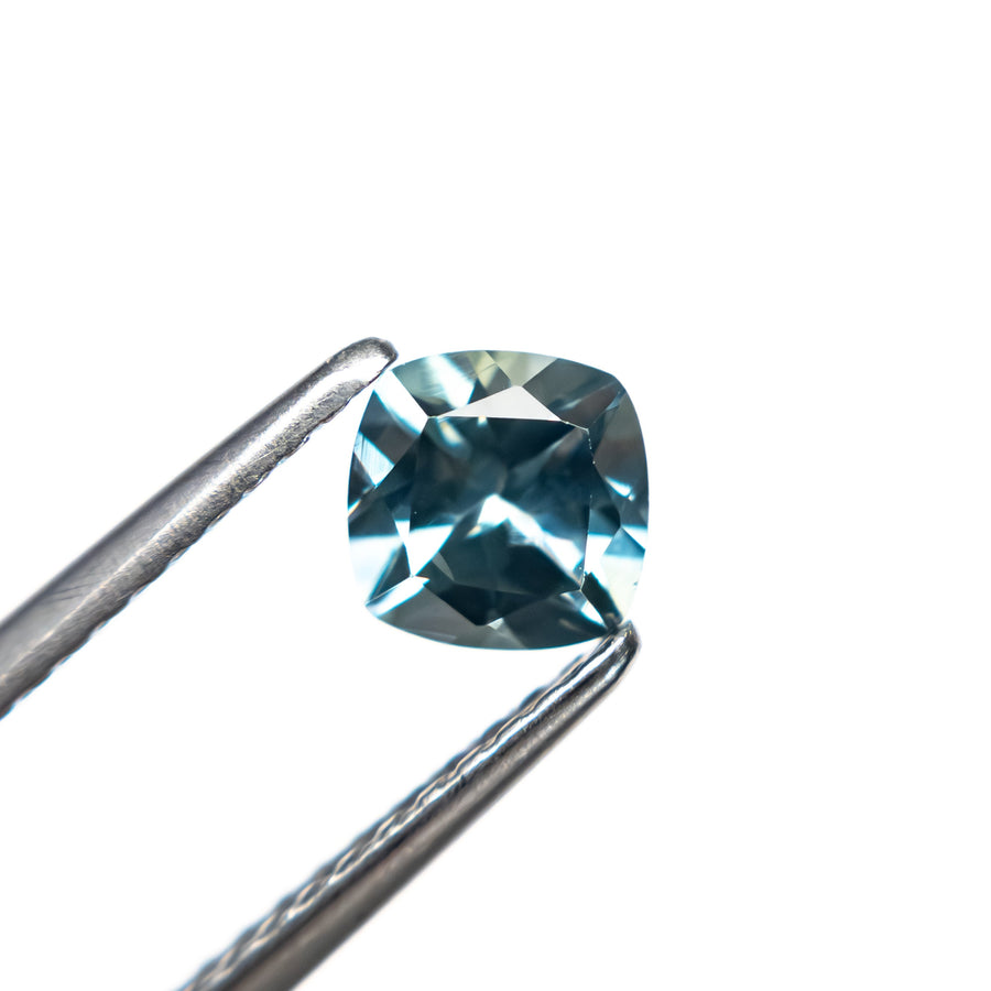 The 0.76ct 5.06x5.00x3.48mm Cushion Brilliant Sapphire 23466-13 by East London jeweller Rachel Boston | Discover our collections of unique and timeless engagement rings, wedding rings, and modern fine jewellery. - Rachel Boston Jewellery
