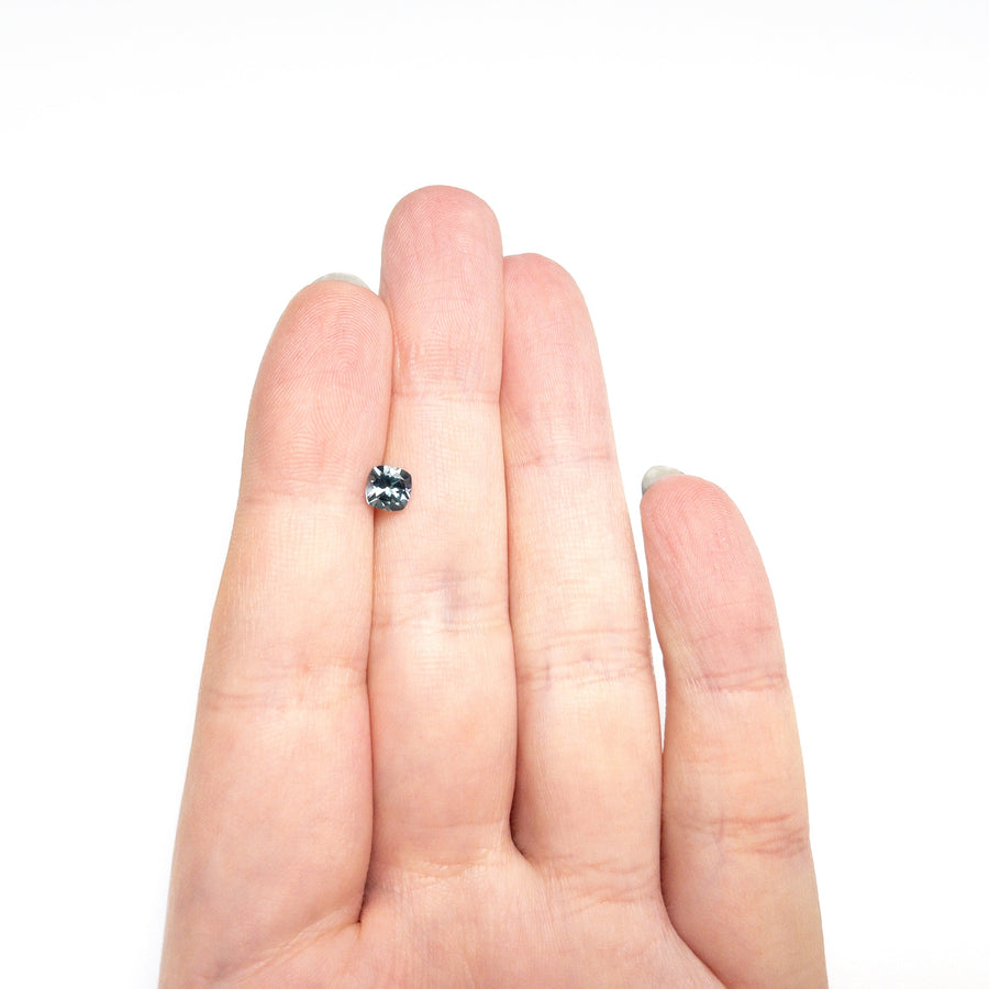 The 0.76ct 5.06x5.00x3.48mm Cushion Brilliant Sapphire 23466-13 by East London jeweller Rachel Boston | Discover our collections of unique and timeless engagement rings, wedding rings, and modern fine jewellery. - Rachel Boston Jewellery