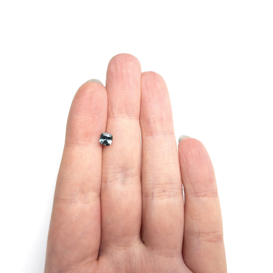 The 0.81ct 5.10x5.08x3.56mm Cushion Brilliant Sapphire 23466-14 by East London jeweller Rachel Boston | Discover our collections of unique and timeless engagement rings, wedding rings, and modern fine jewellery. - Rachel Boston Jewellery