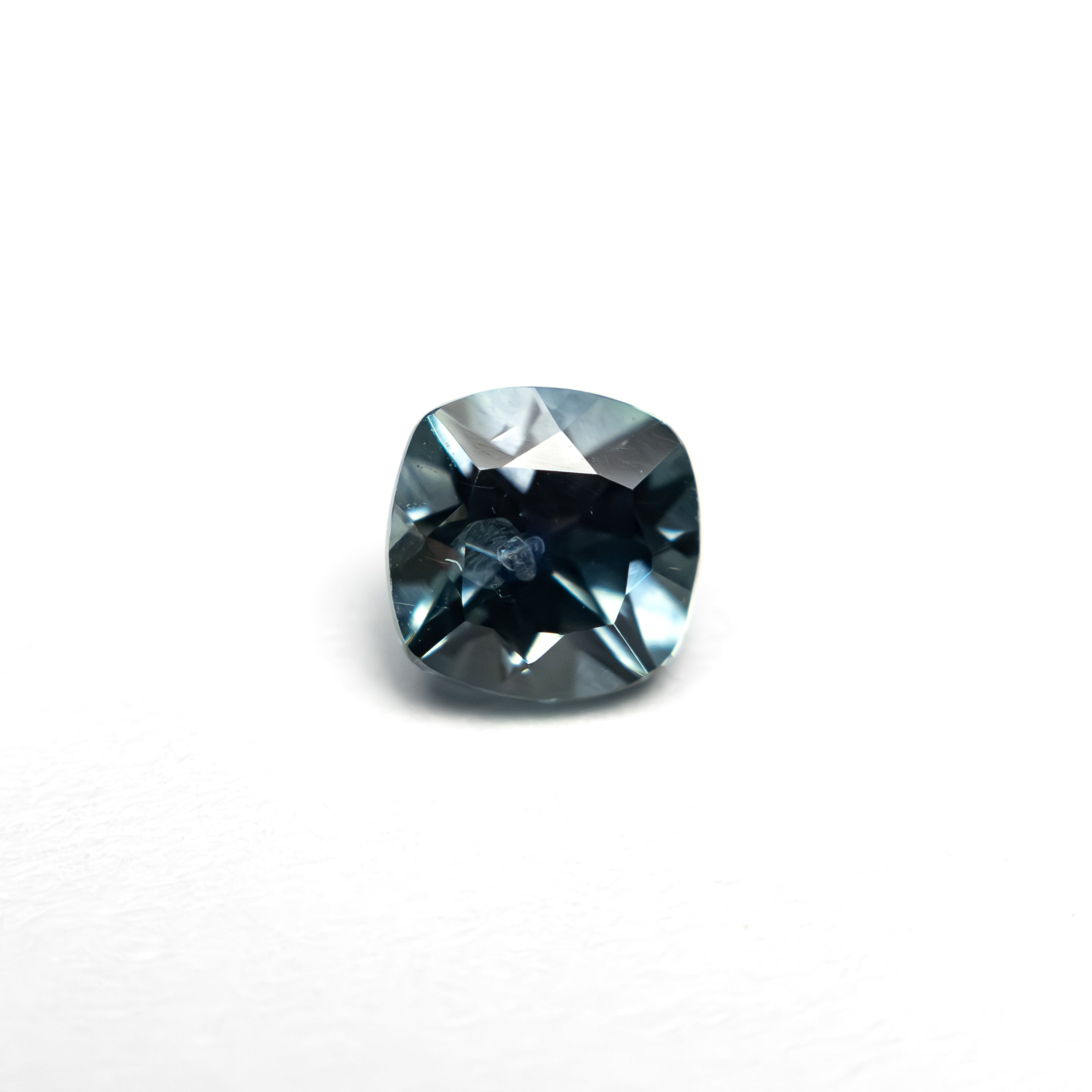 The 0.82ct 5.05x5.02x3.77mm Cushion Brilliant Sapphire 23466-15 by East London jeweller Rachel Boston | Discover our collections of unique and timeless engagement rings, wedding rings, and modern fine jewellery.