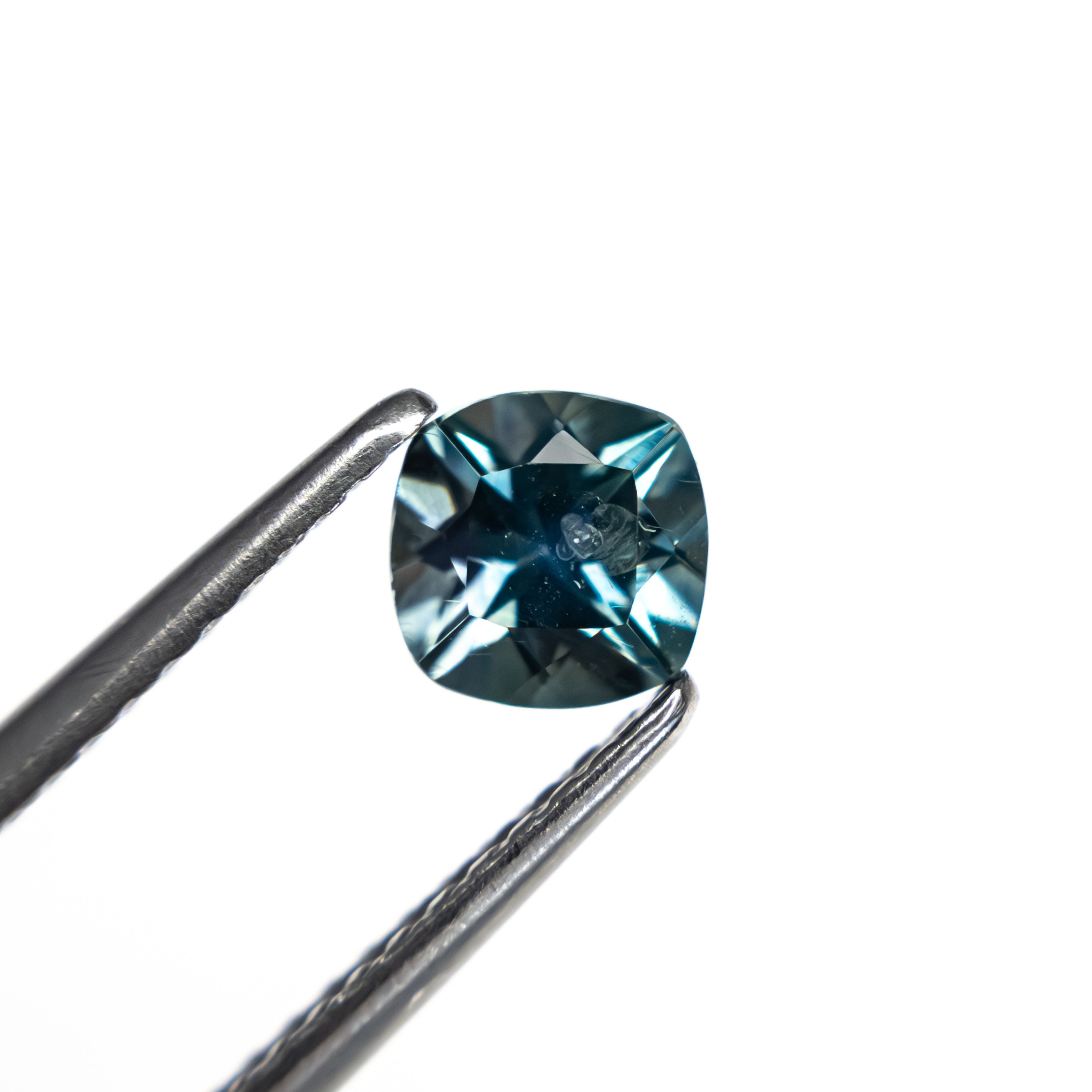 The 0.82ct 5.05x5.02x3.77mm Cushion Brilliant Sapphire 23466-15 by East London jeweller Rachel Boston | Discover our collections of unique and timeless engagement rings, wedding rings, and modern fine jewellery.