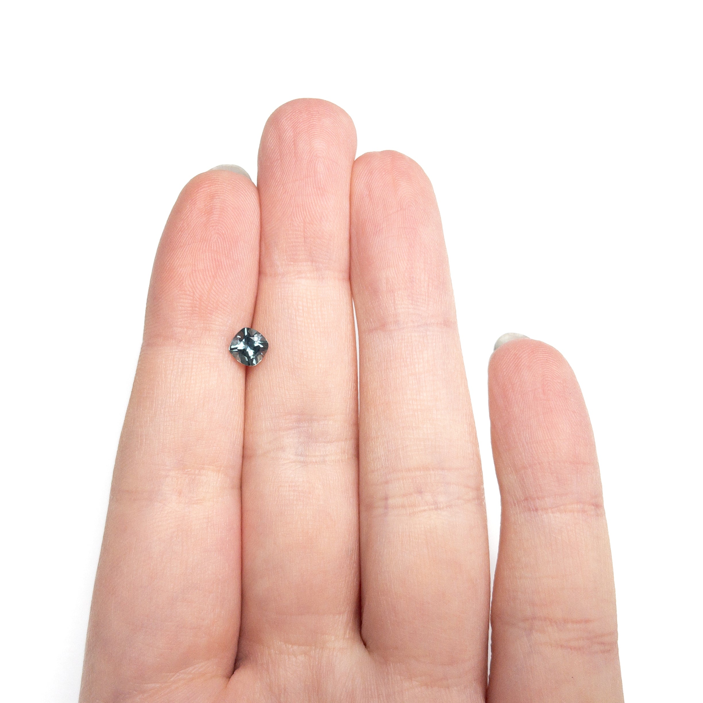The 0.82ct 5.05x5.02x3.77mm Cushion Brilliant Sapphire 23466-15 by East London jeweller Rachel Boston | Discover our collections of unique and timeless engagement rings, wedding rings, and modern fine jewellery.