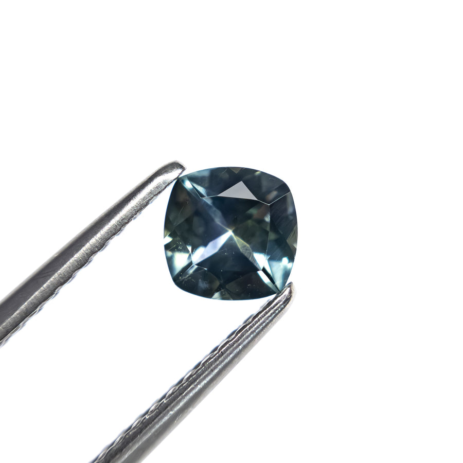 The 0.65ct 5.09x5.06x3.09mm Cushion Brilliant Sapphire 23466-17 by East London jeweller Rachel Boston | Discover our collections of unique and timeless engagement rings, wedding rings, and modern fine jewellery. - Rachel Boston Jewellery