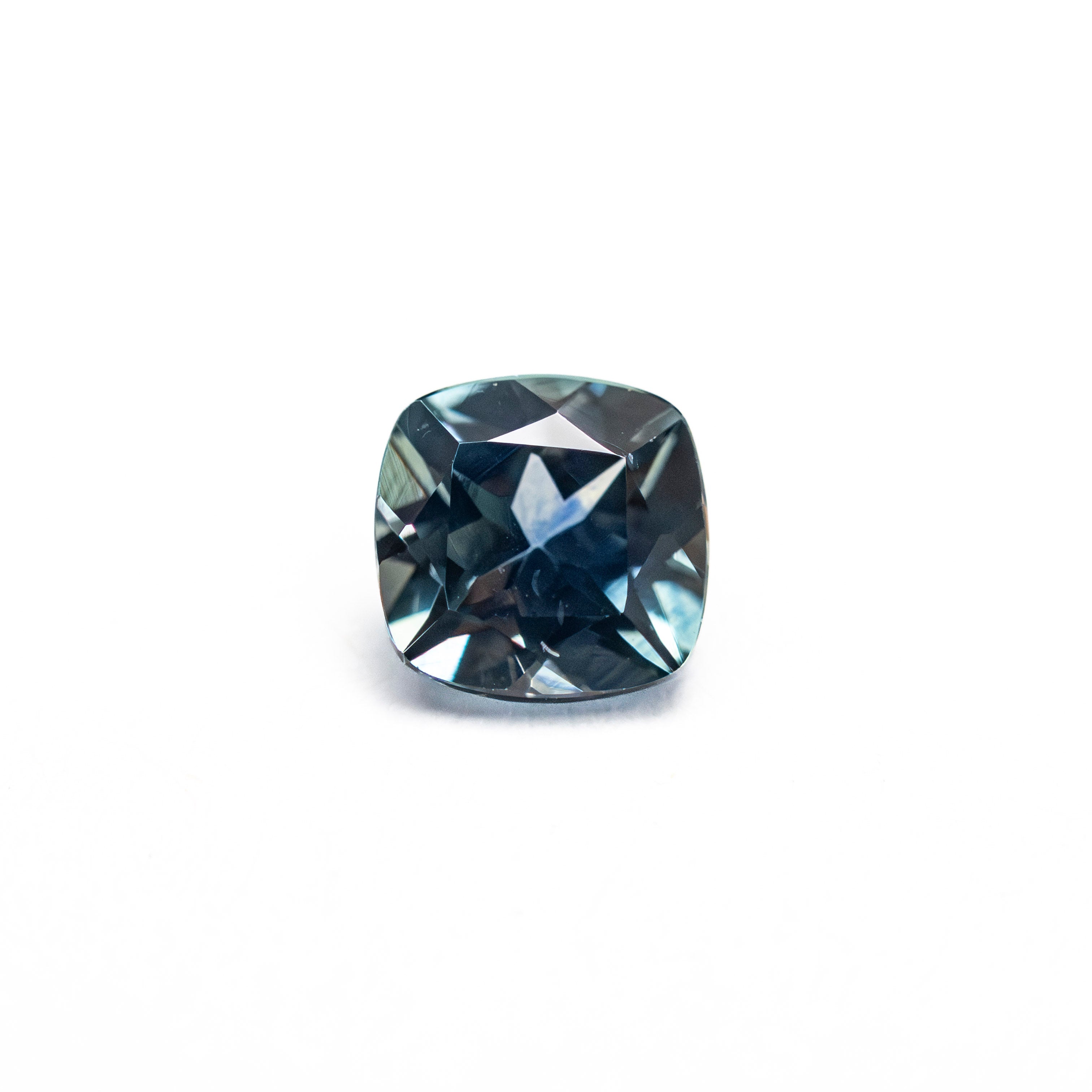 The 0.76ct 5.15x5.08x3.41mm Cushion Brilliant Sapphire 23466-19 by East London jeweller Rachel Boston | Discover our collections of unique and timeless engagement rings, wedding rings, and modern fine jewellery.