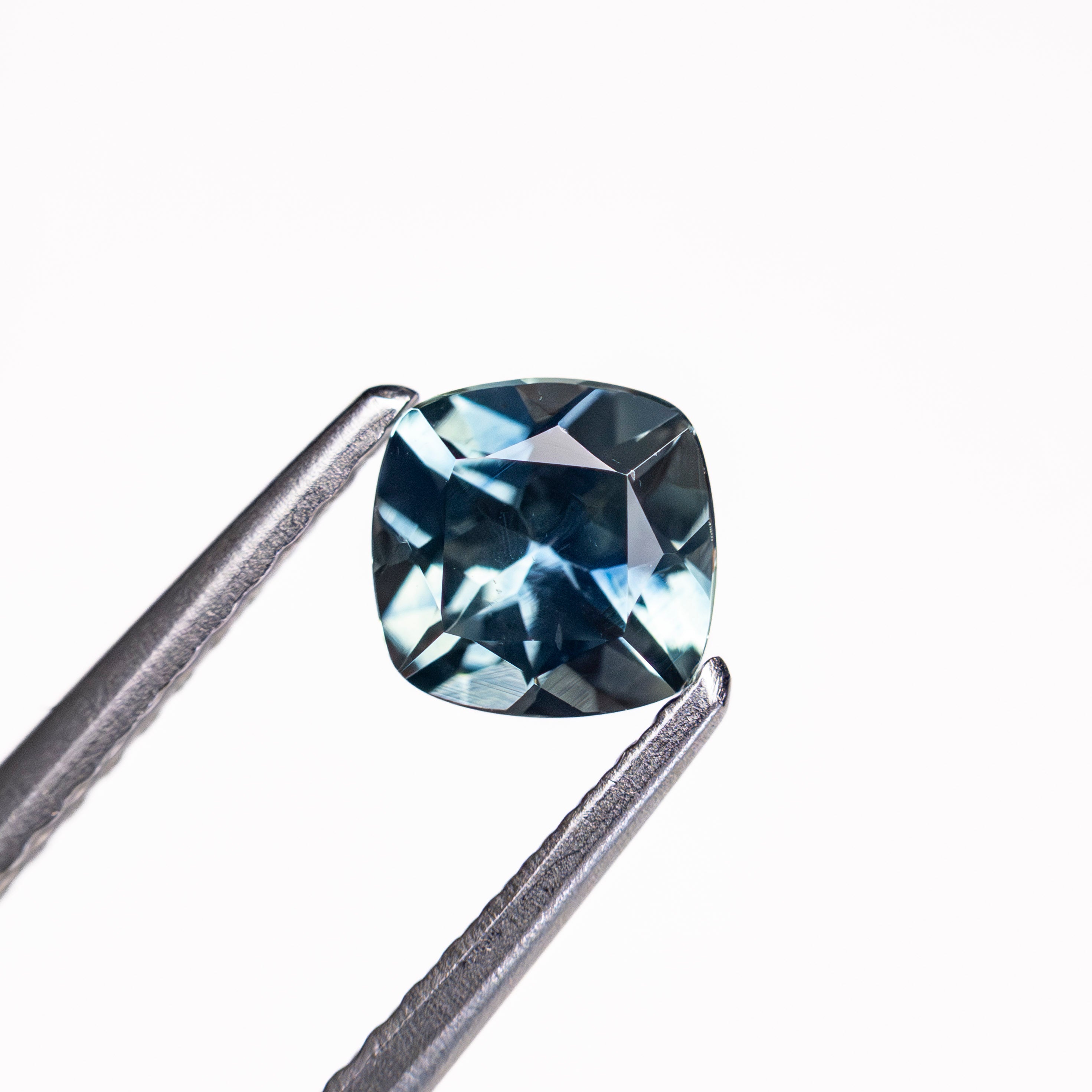 The 0.76ct 5.15x5.08x3.41mm Cushion Brilliant Sapphire 23466-19 by East London jeweller Rachel Boston | Discover our collections of unique and timeless engagement rings, wedding rings, and modern fine jewellery.