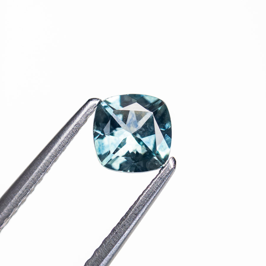 The 0.68ct 5.06x4.99x3.05mm Cushion Brilliant Sapphire 23466-20 by East London jeweller Rachel Boston | Discover our collections of unique and timeless engagement rings, wedding rings, and modern fine jewellery. - Rachel Boston Jewellery
