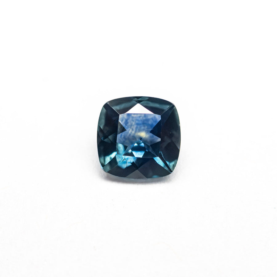 The 0.63ct 5.08x5.07x2.76mm Cushion Brilliant Sapphire 23466-23 by East London jeweller Rachel Boston | Discover our collections of unique and timeless engagement rings, wedding rings, and modern fine jewellery. - Rachel Boston Jewellery