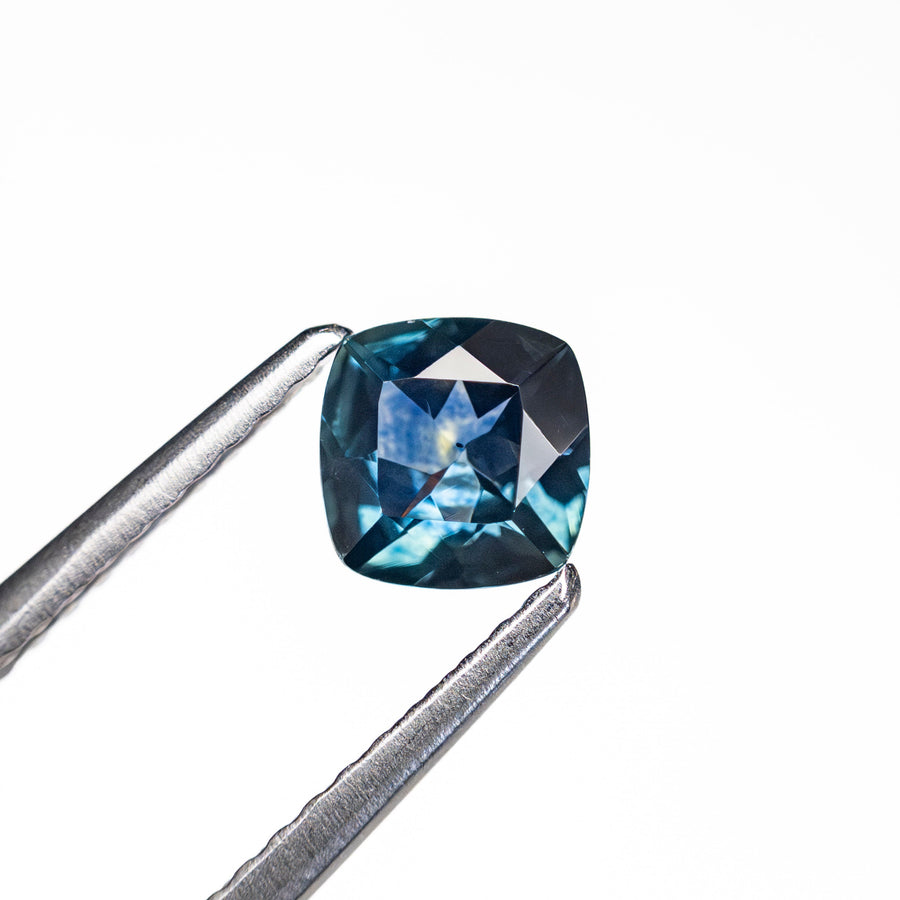 The 0.63ct 5.08x5.07x2.76mm Cushion Brilliant Sapphire 23466-23 by East London jeweller Rachel Boston | Discover our collections of unique and timeless engagement rings, wedding rings, and modern fine jewellery. - Rachel Boston Jewellery
