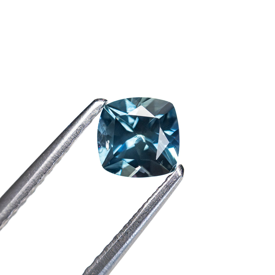 The 0.67ct 5.00x4.88x3.28mm Cushion Brilliant Sapphire 23466-25 by East London jeweller Rachel Boston | Discover our collections of unique and timeless engagement rings, wedding rings, and modern fine jewellery. - Rachel Boston Jewellery