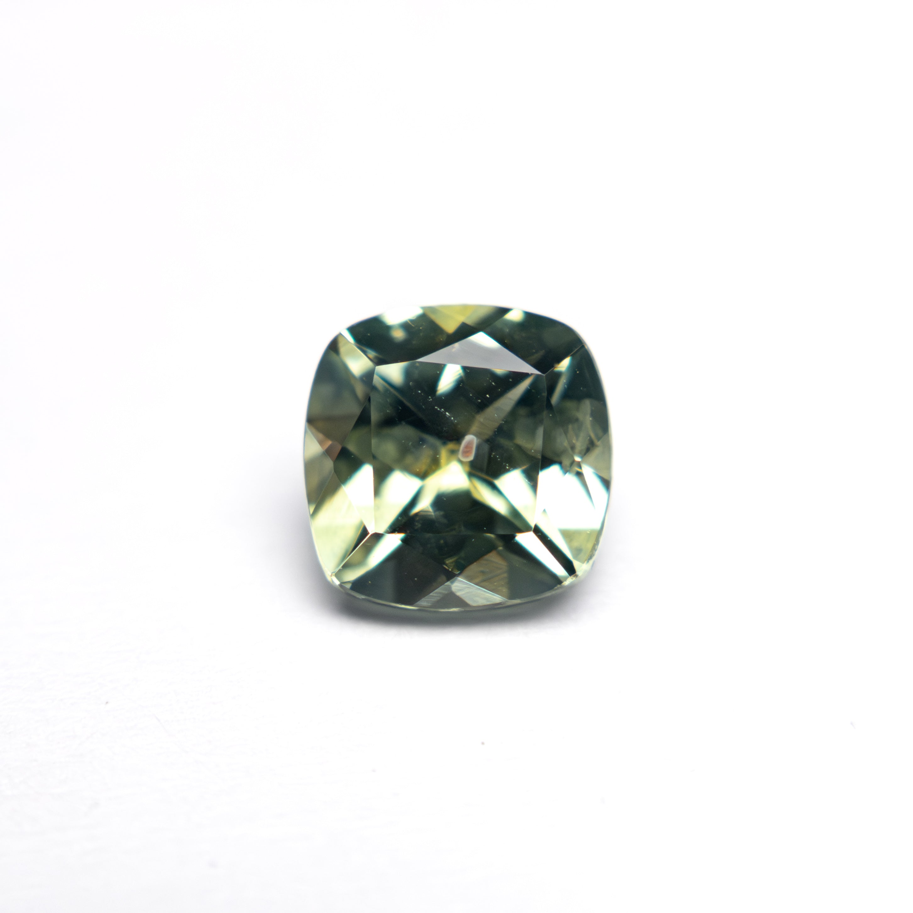 The 1.25ct 6.07x6.04x3.98mm Cushion Brilliant Sapphire 23468-02 by East London jeweller Rachel Boston | Discover our collections of unique and timeless engagement rings, wedding rings, and modern fine jewellery.