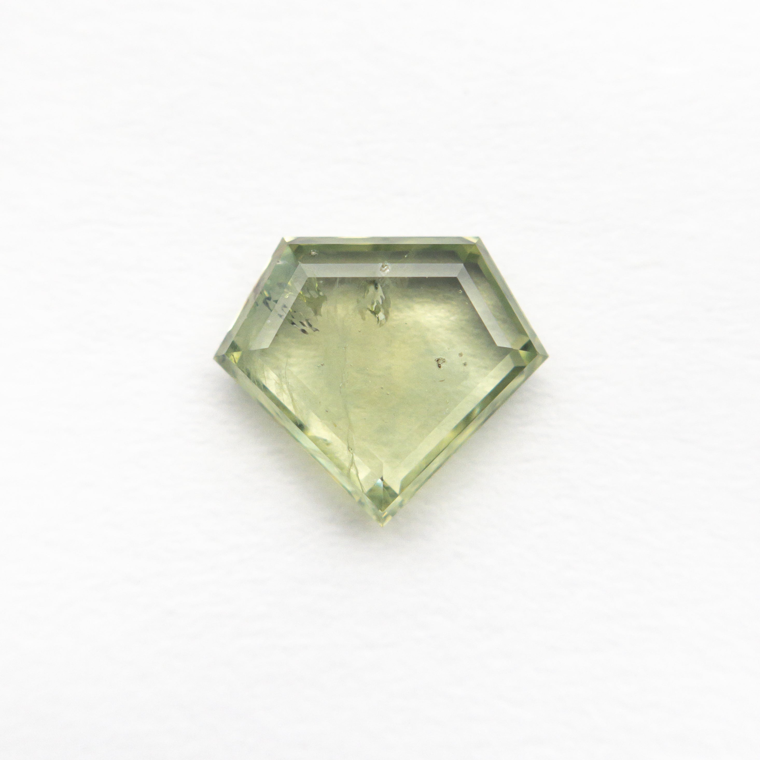 The 1.30ct 6.89x7.98x2.38mm Shield Portrait Cut Sapphire 23469-29 by East London jeweller Rachel Boston | Discover our collections of unique and timeless engagement rings, wedding rings, and modern fine jewellery.