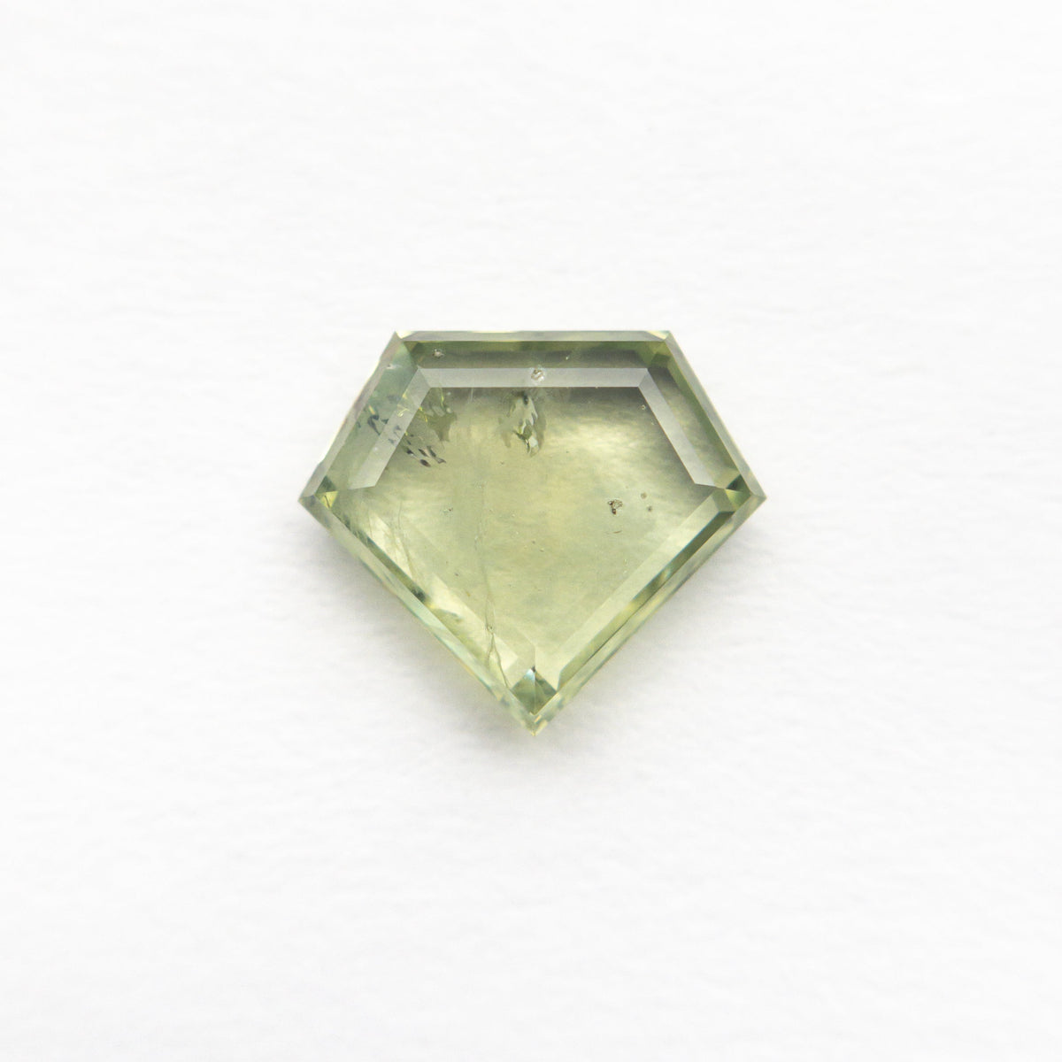 The 1.30ct 6.89x7.98x2.38mm Shield Portrait Cut Sapphire 23469-29 by East London jeweller Rachel Boston | Discover our collections of unique and timeless engagement rings, wedding rings, and modern fine jewellery.