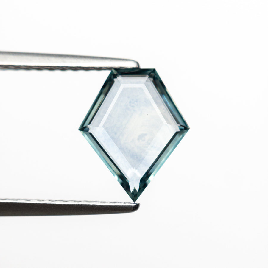 The 1.24ct 9.51x7.88x1.97mm Shield Portrait Cut Sapphire 23474-16 by East London jeweller Rachel Boston | Discover our collections of unique and timeless engagement rings, wedding rings, and modern fine jewellery. - Rachel Boston Jewellery