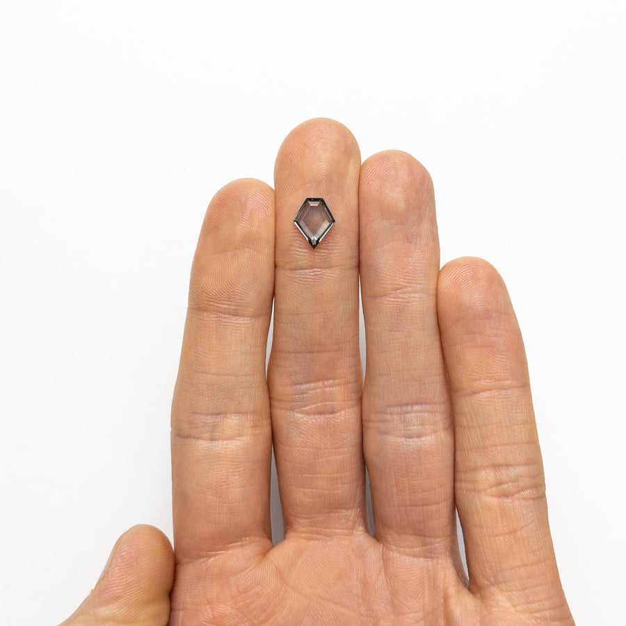 The 1.24ct 9.51x7.88x1.97mm Shield Portrait Cut Sapphire 23474-16 by East London jeweller Rachel Boston | Discover our collections of unique and timeless engagement rings, wedding rings, and modern fine jewellery. - Rachel Boston Jewellery
