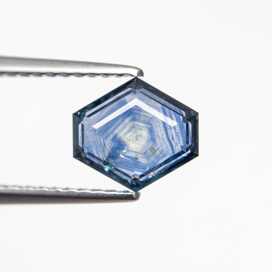 The 1.26ct 7.53x6.91x2.53mm Hexagon Portrait Cut Sapphire 23474-45 by East London jeweller Rachel Boston | Discover our collections of unique and timeless engagement rings, wedding rings, and modern fine jewellery. - Rachel Boston Jewellery