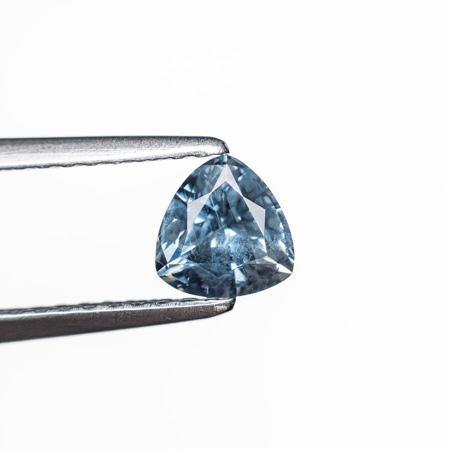The 0.69ct 4.92x4.99x3.67mm Trillion Brilliant Sapphire 23675-09 by East London jeweller Rachel Boston | Discover our collections of unique and timeless engagement rings, wedding rings, and modern fine jewellery. - Rachel Boston Jewellery