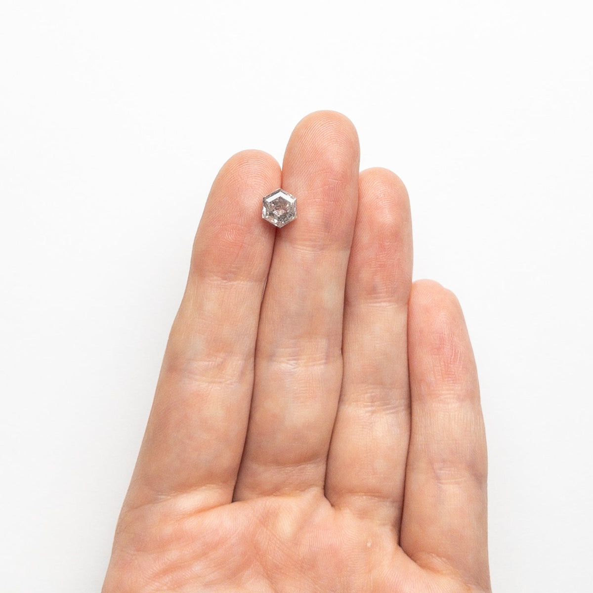 The 1.62ct 7.05x6.10x4.46mm Hexagon Step Cut 🇨🇦 23969-01 by East London jeweller Rachel Boston | Discover our collections of unique and timeless engagement rings, wedding rings, and modern fine jewellery.
