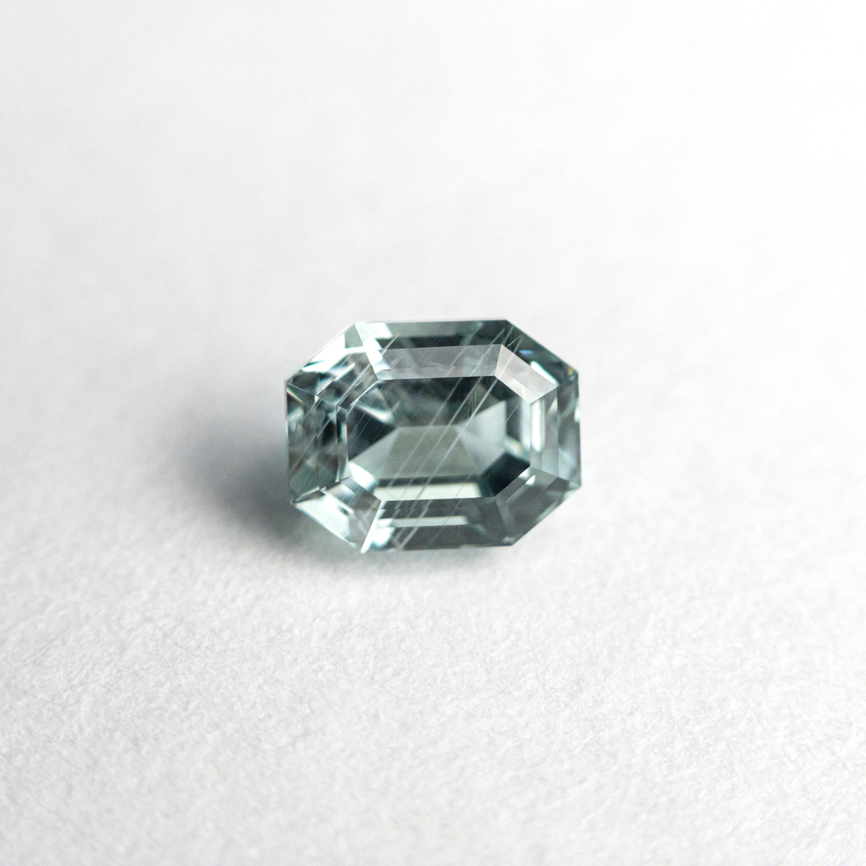 The 0.93ct 5.50x4.29x3.85mm Cut Corner Rectangle Step Cut Sapphire 23705-07 by East London jeweller Rachel Boston | Discover our collections of unique and timeless engagement rings, wedding rings, and modern fine jewellery.