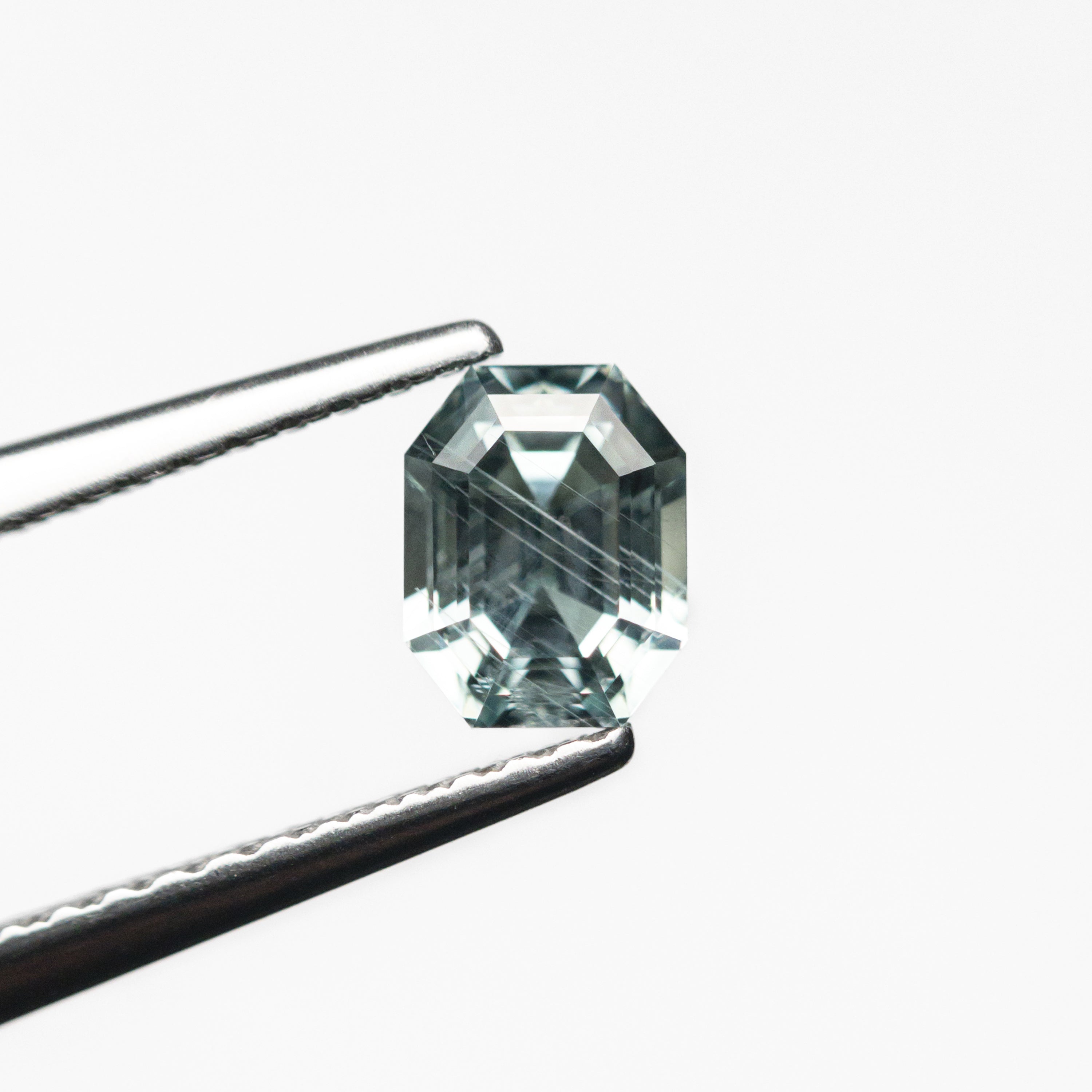 The 0.93ct 5.50x4.29x3.85mm Cut Corner Rectangle Step Cut Sapphire 23705-07 by East London jeweller Rachel Boston | Discover our collections of unique and timeless engagement rings, wedding rings, and modern fine jewellery.