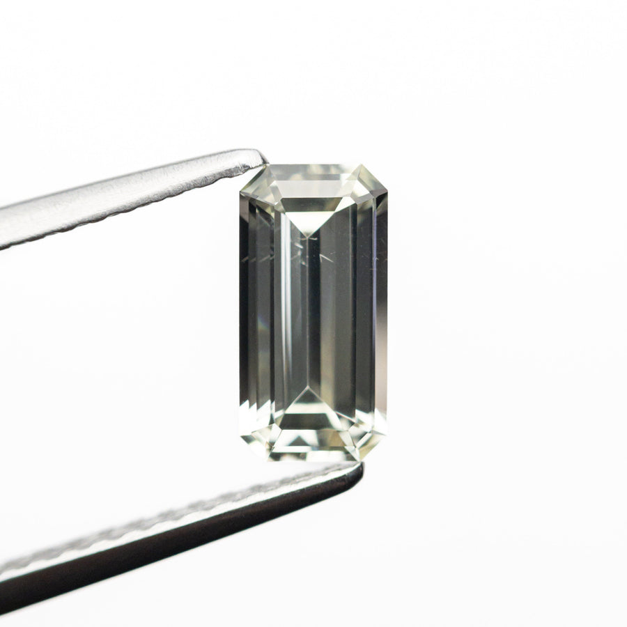 The 0.85ct 7.97x3.98x2.54mm Cut Corner Rectangle Step Cut Sapphire 23773-02 by East London jeweller Rachel Boston | Discover our collections of unique and timeless engagement rings, wedding rings, and modern fine jewellery. - Rachel Boston Jewellery