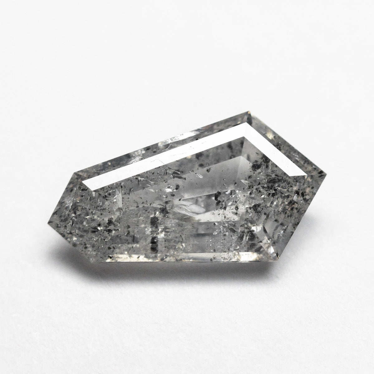 The 1.93ct 12.71x6.95x3.07mm Shield Step Cut 23834-05 by East London jeweller Rachel Boston | Discover our collections of unique and timeless engagement rings, wedding rings, and modern fine jewellery.