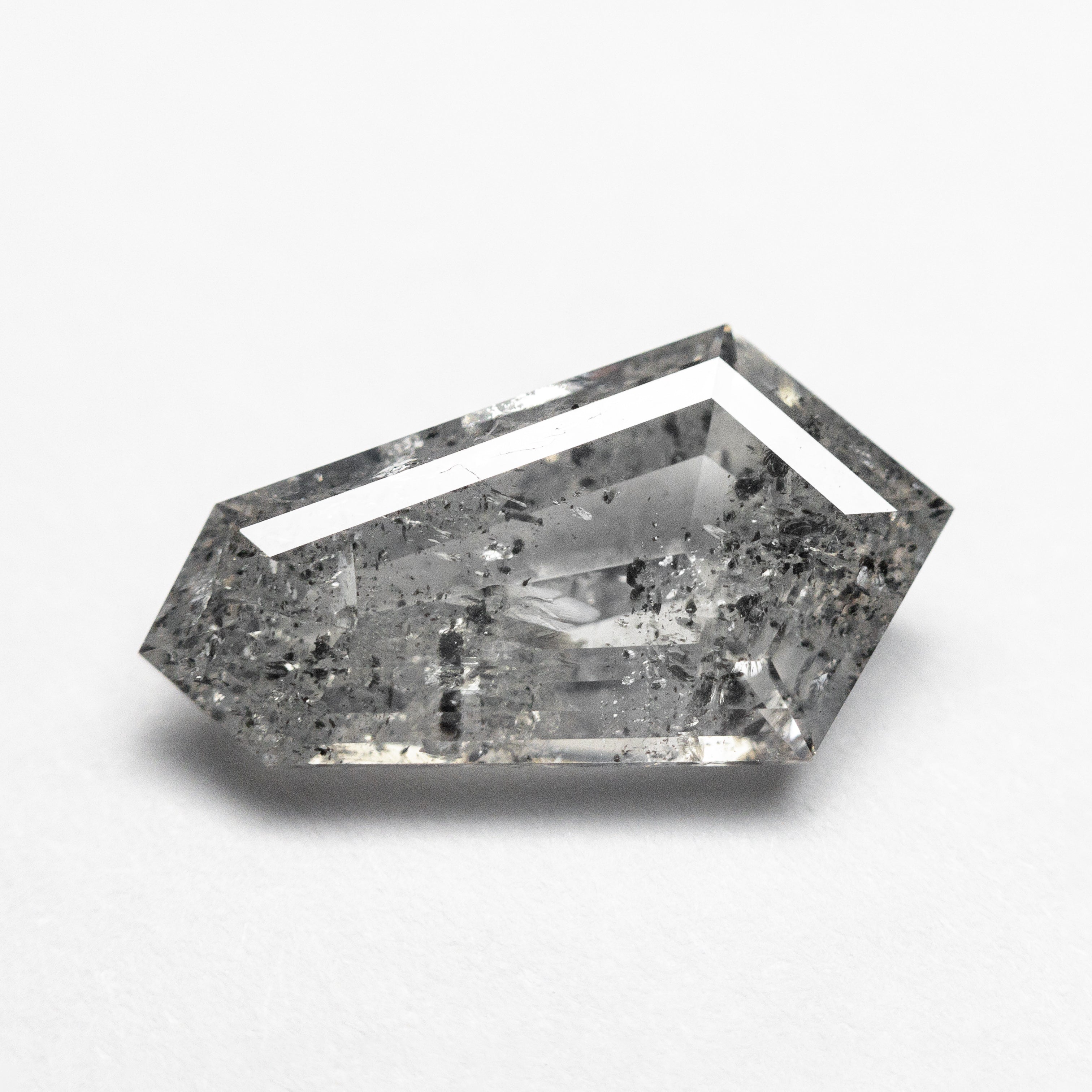 The 1.93ct 12.71x6.95x3.07mm Shield Step Cut 23834-05 by East London jeweller Rachel Boston | Discover our collections of unique and timeless engagement rings, wedding rings, and modern fine jewellery.