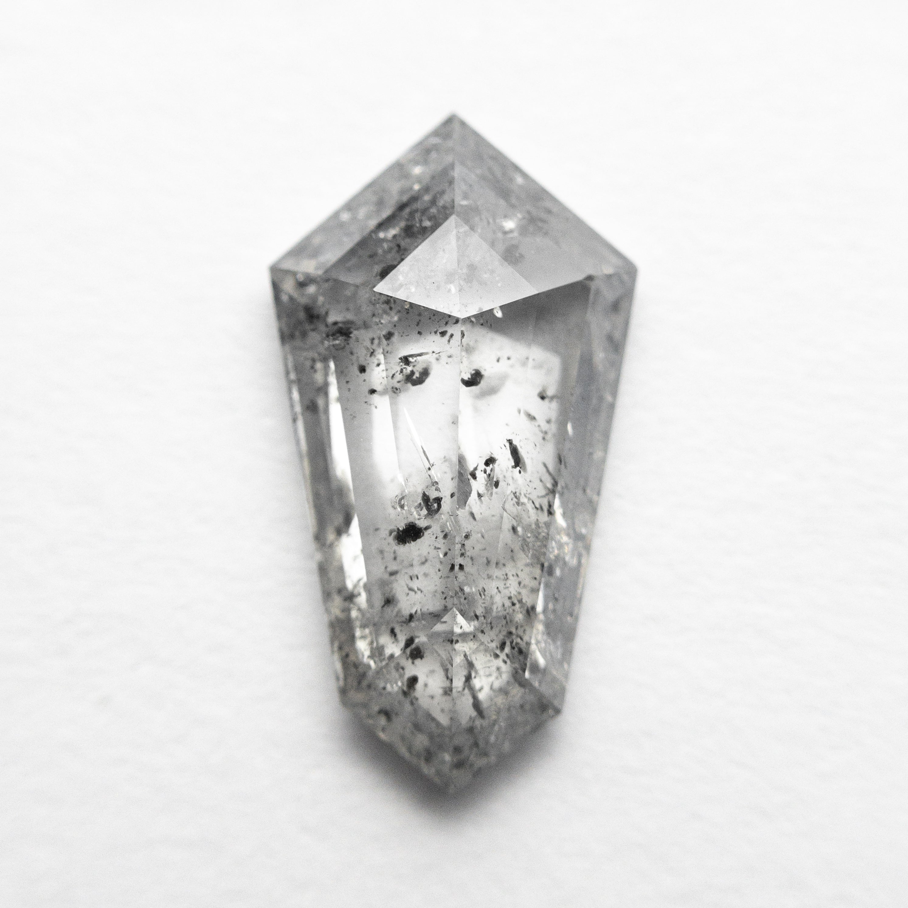 The 1.93ct 12.71x6.95x3.07mm Shield Step Cut 23834-05 by East London jeweller Rachel Boston | Discover our collections of unique and timeless engagement rings, wedding rings, and modern fine jewellery.